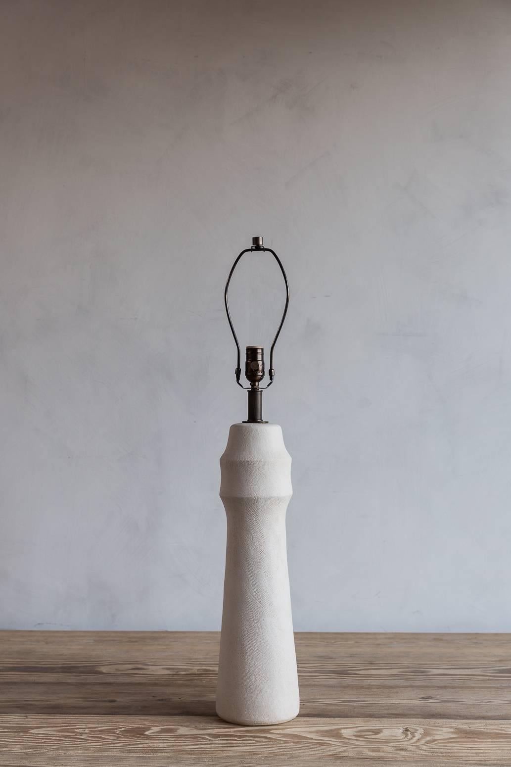 Matte Ecru Gedde lamp handmade by Ceramicist Mirena Kim. Shade not included, lamp base measures 20