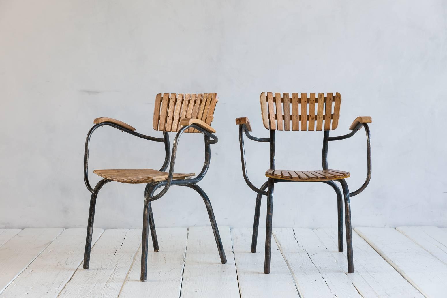 Set of four slatted metal and wood armchairs.