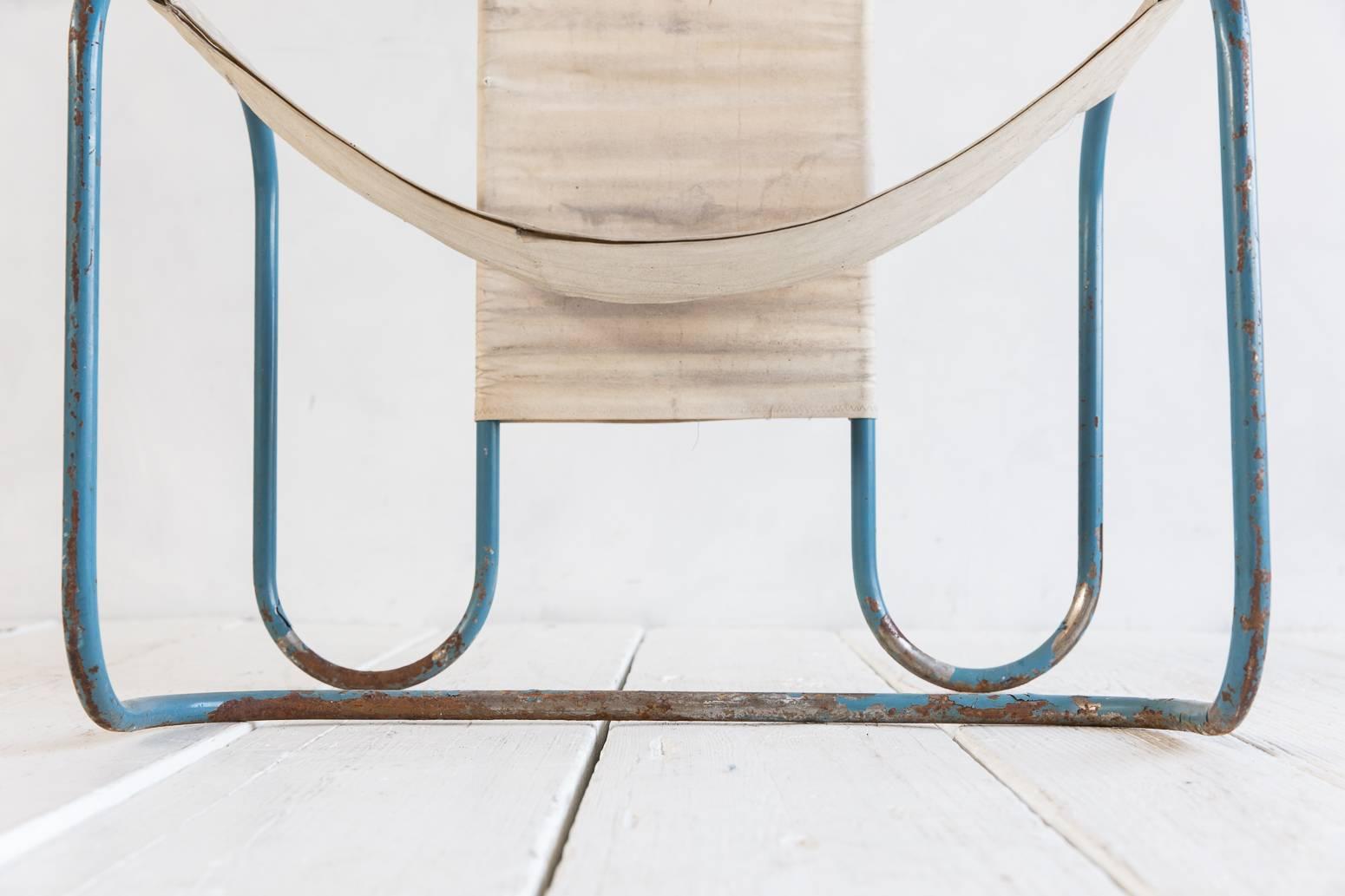 Painted blue metal Bauhaus sling chair with original canvas upholstery.