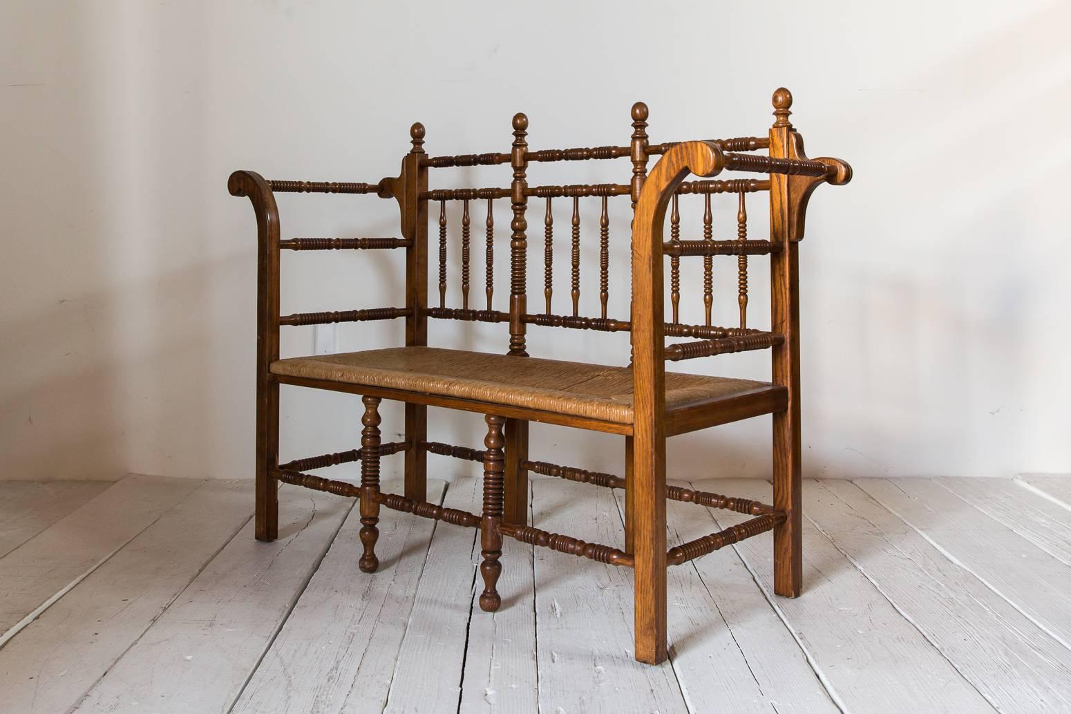 Early 20th Century Dark Oak Edwardian Spindle Bench with Rush Seat