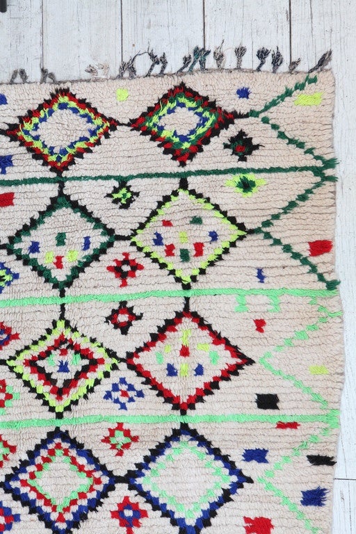 Vintage colorful Azilal berber rug from the High Atlas Mountains.