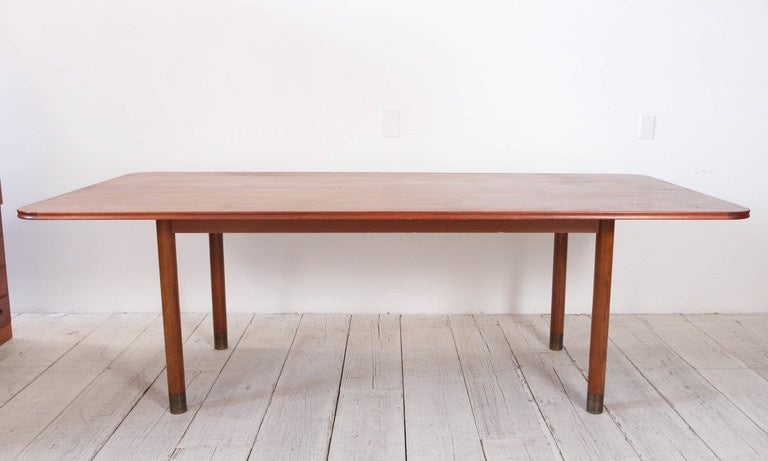 Large oak dining table with brass cap legs in the style of Borge Mogensen and Charlotte Perriand.
