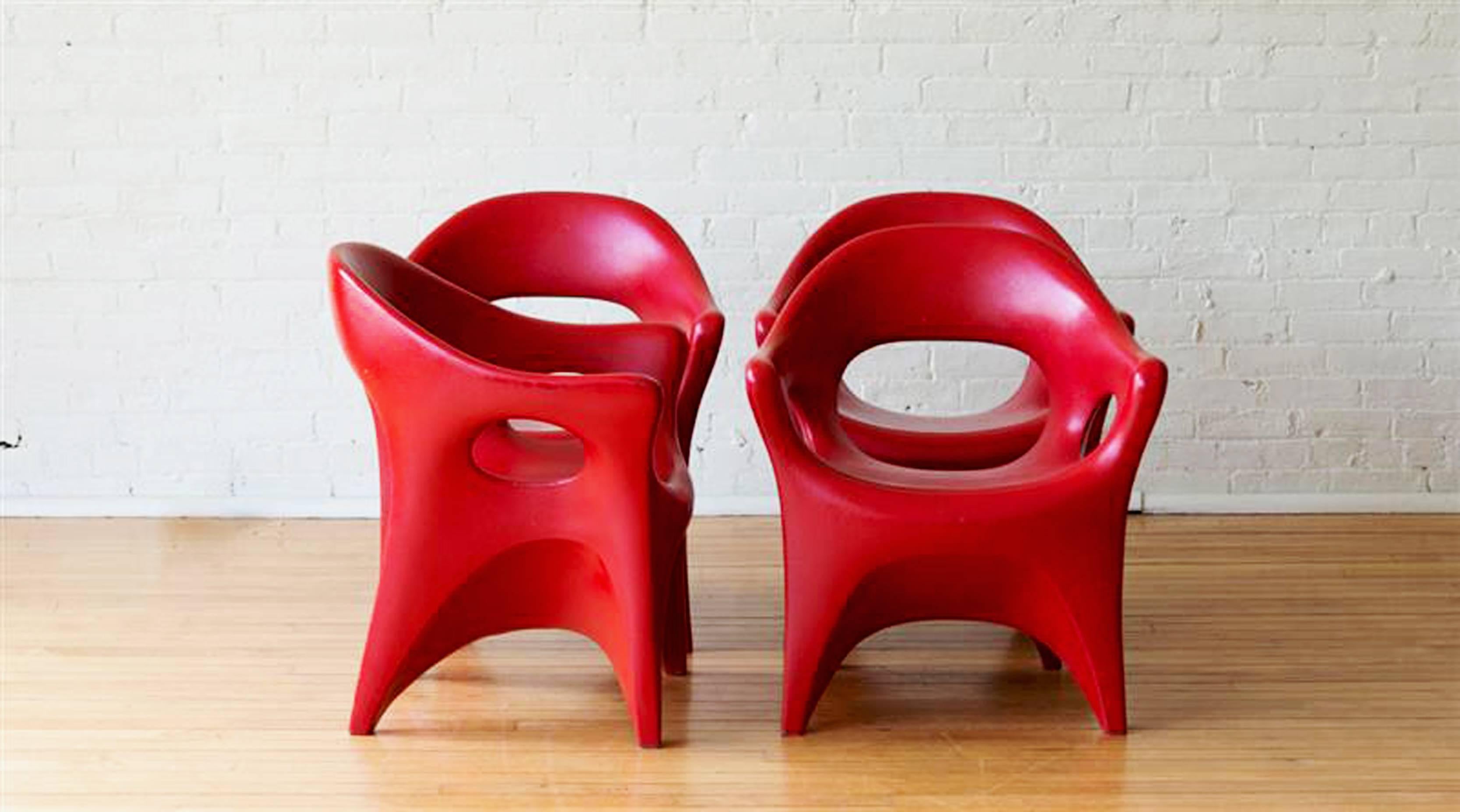 Atomic Age rotocast plastic chairs by John Gale, in a great dark red color.
circa 1963.

Patented in 1963, each one has patent number stamped and John Gale logo. Design was used to develop rotocast technology which was used later in the 1960s on