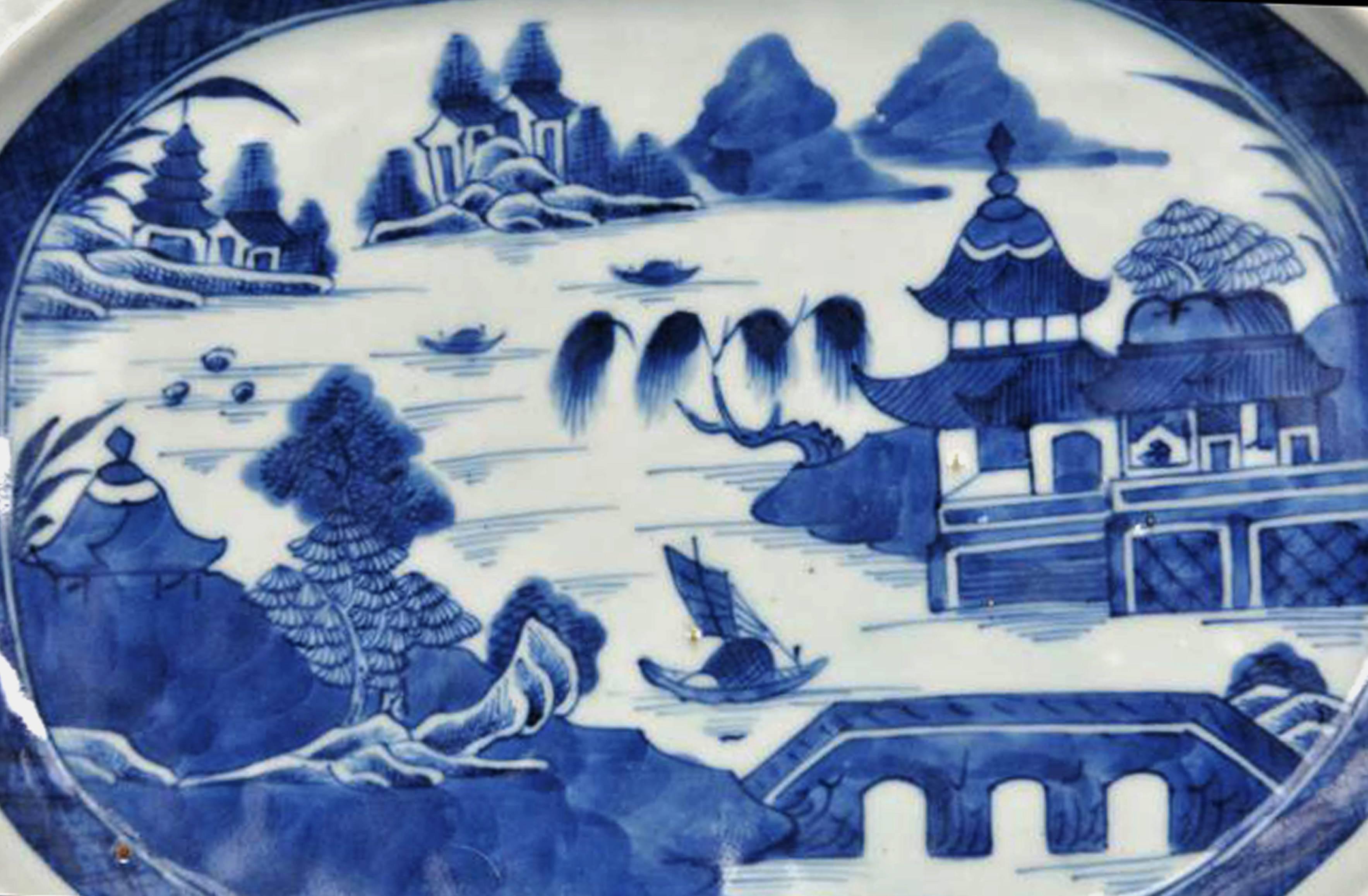 Chinese export underglaze blue porcelain rare hot water warming dish,
Circa 1810-1830.

The rare rectangular-form deep hot water warming dish is painted in underglaze-blue with a scene of a river with mountains in the background and in the