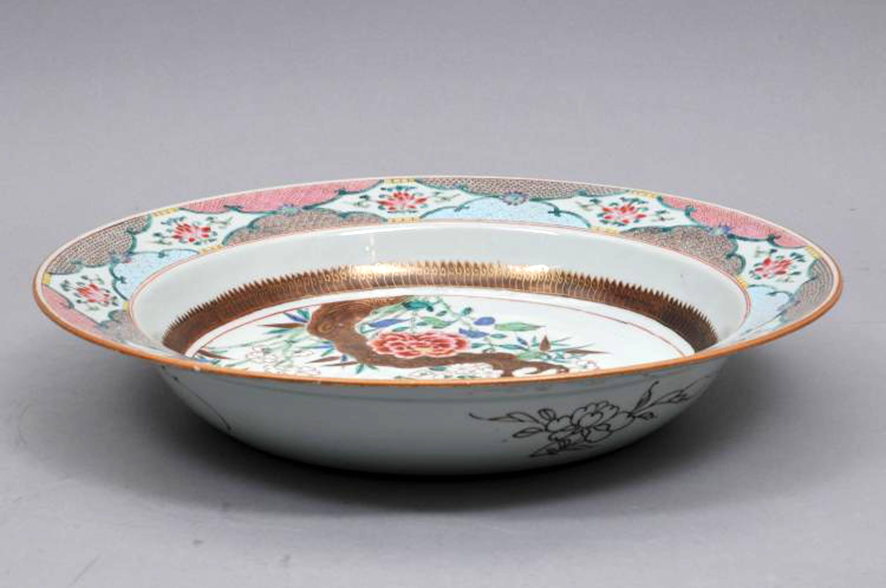 Chinese export famille rose porcelain basin, Mid-18th Century.

The unusual Chinese Export famille rose deep basin is finely painted with a flowering branch design with two large red flowers and a branch with blooming small white bamboo flowers.