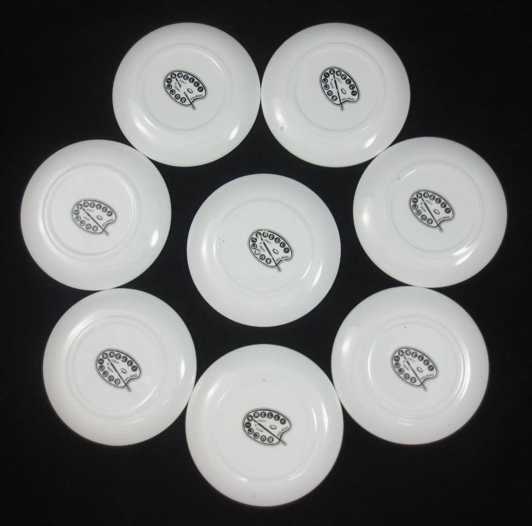 Set of eight midcentury Bucciarelli Musical Coasters,
circa 1960.

Wonderful set of eight small plates each with a different musical instrument.

Bucciarelli was a manufacturer in Milan with a close relationship with Fornasetti. Some write that