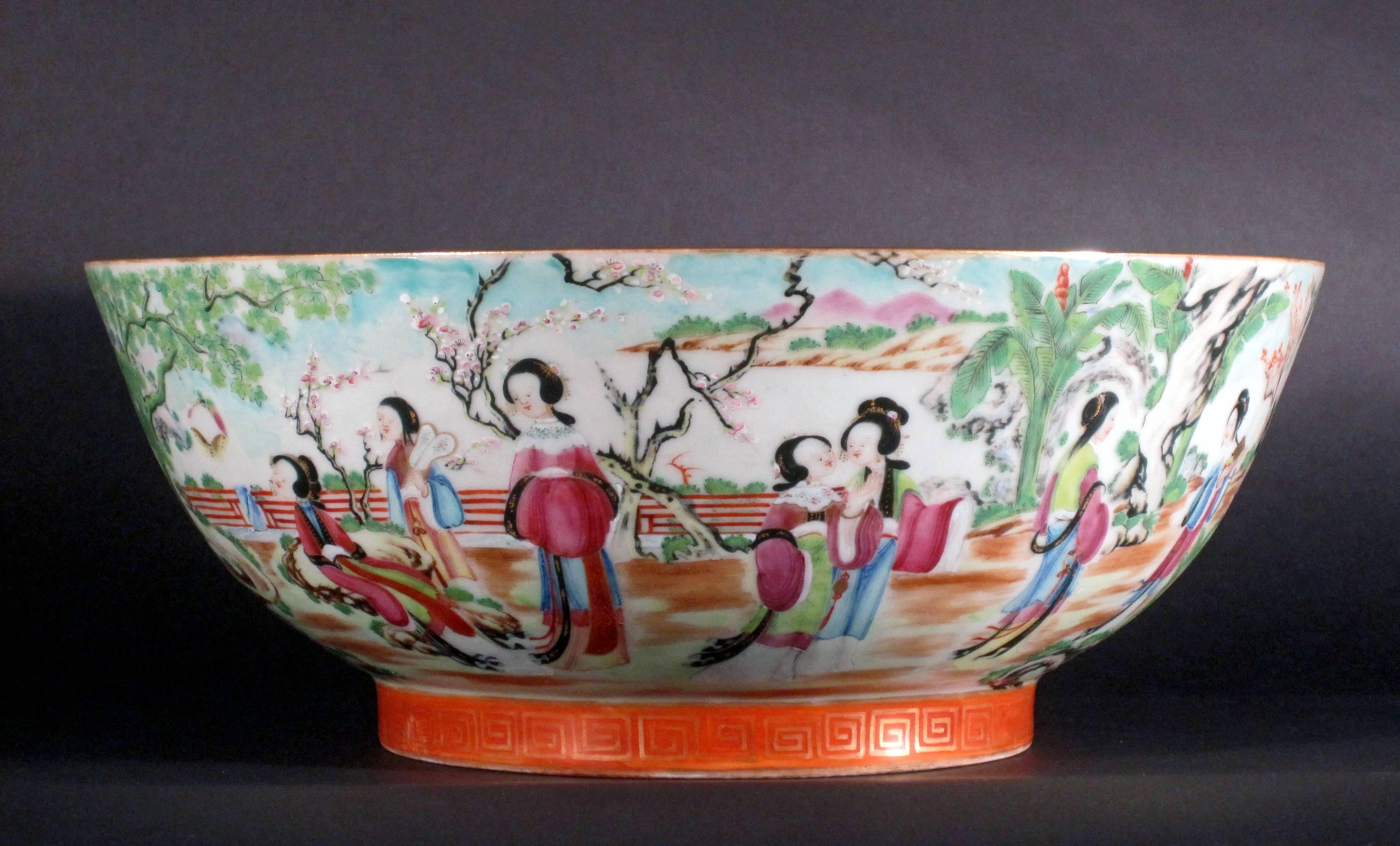 Chinese Porcelain famille rose bowl finely enameled with views of court figures promenading on terraces or acrobats performing for an Emperor, he is seated before a grisaille painting of a dragon that reads "Longfei Fengwu" with a cyclical