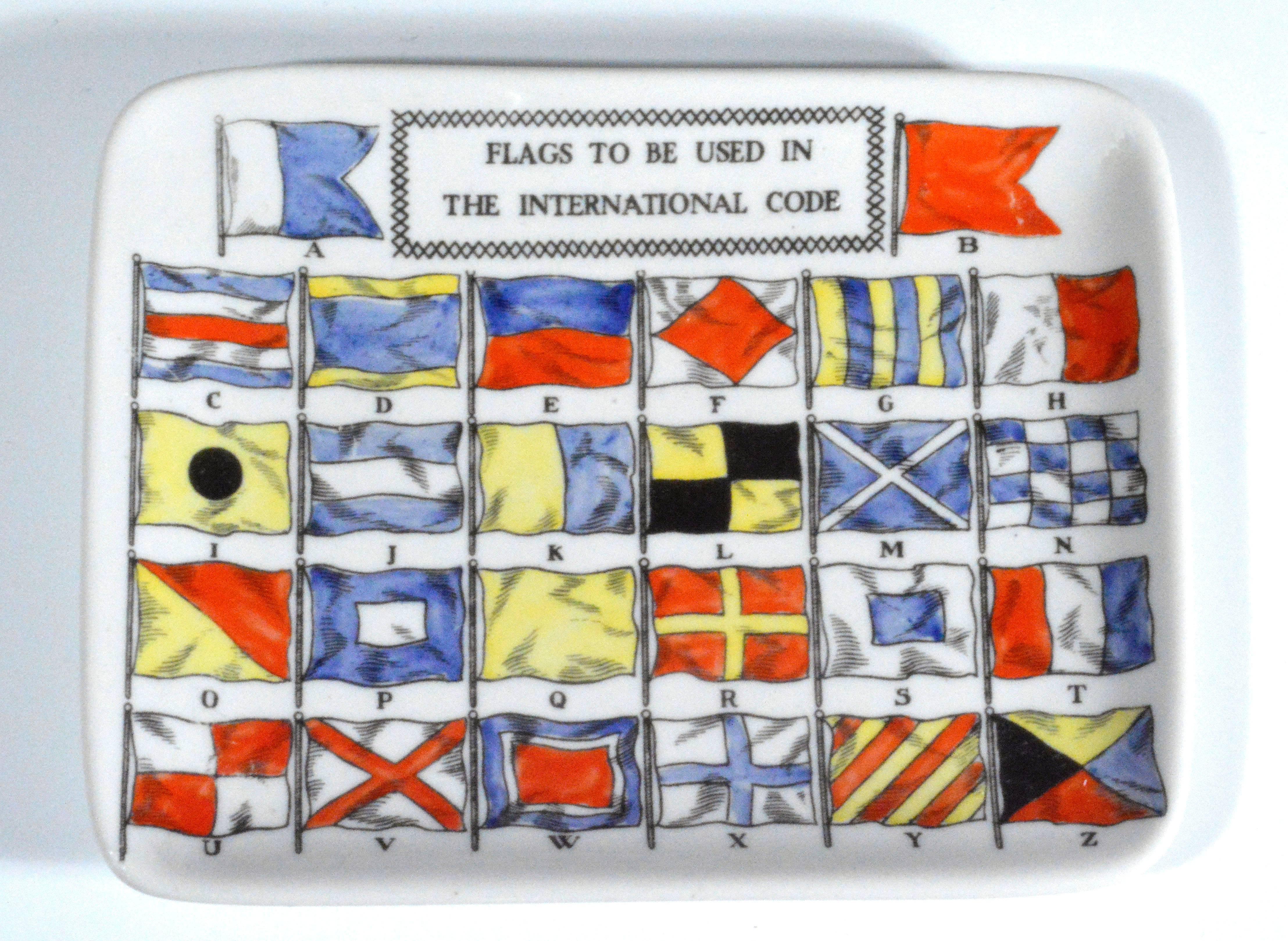  Piero Fornasetti dish from the 1960s is decorated with code flags- the flags are signal flags with their corresponding letter equivalent from A-Z.