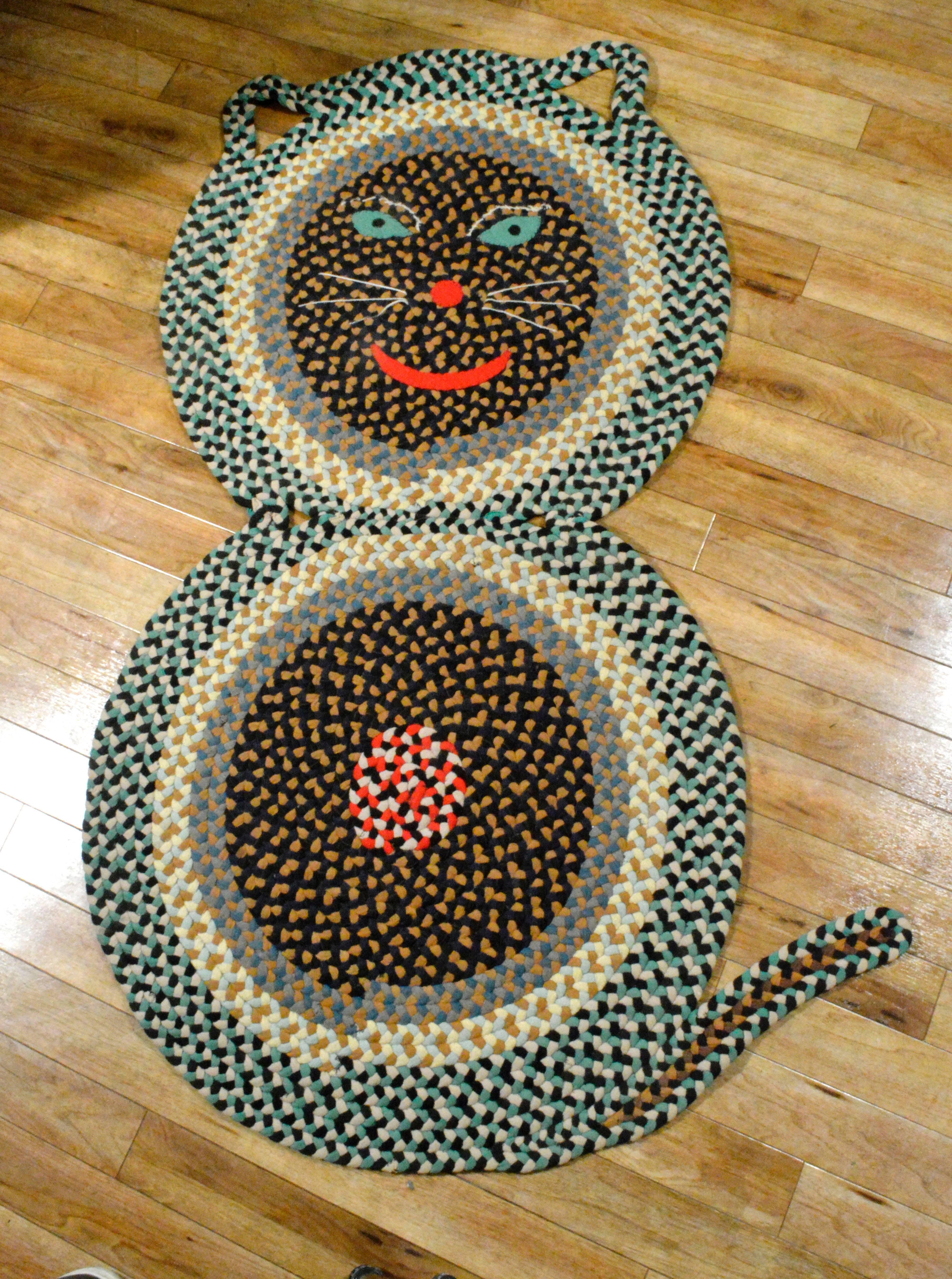The American Cat braided rug is of a large size and incredibly fun and was most likely made in Pennsylvania in the 1940's
1940's.