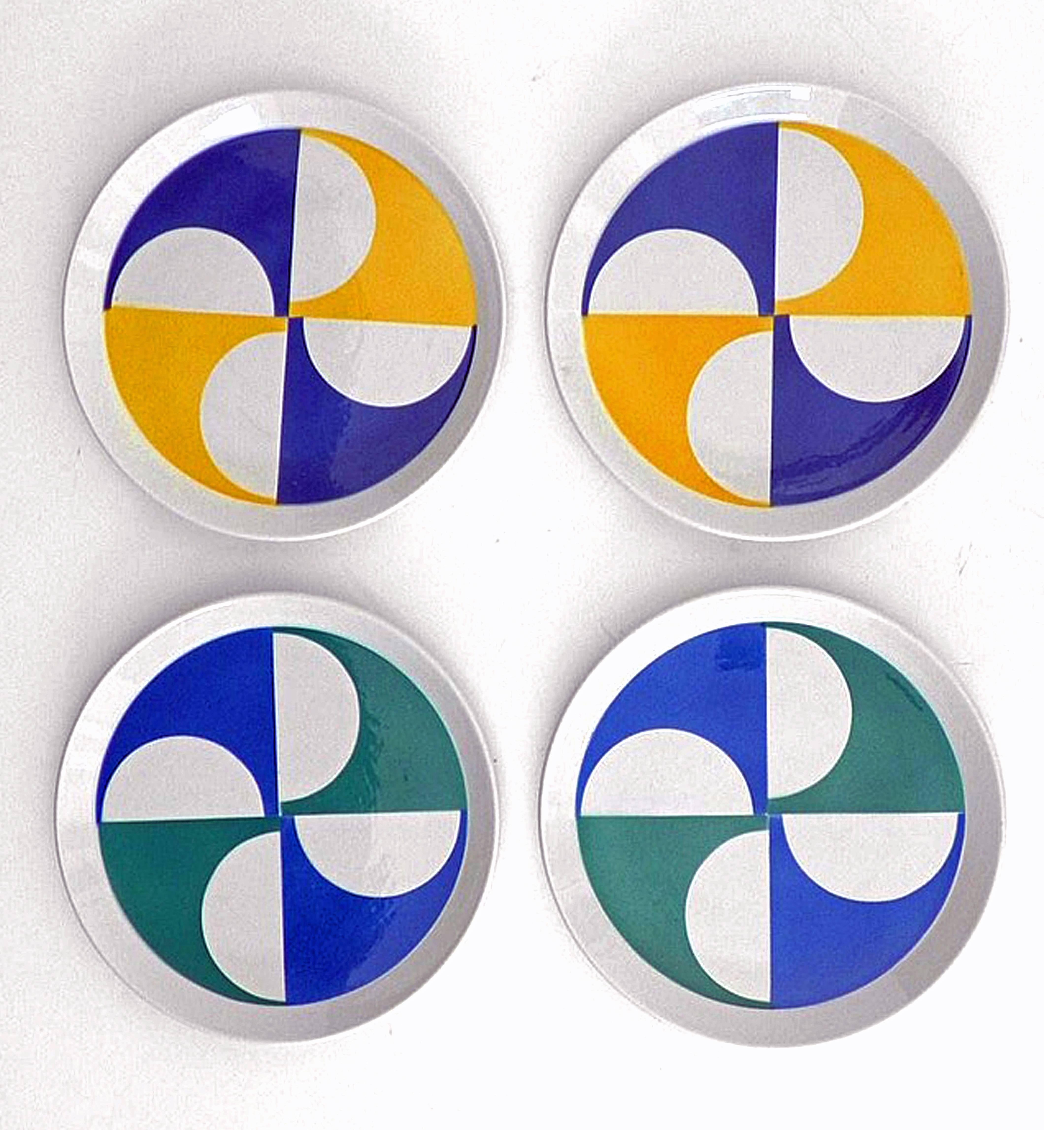 The Gio Ponti modernist plates were made at Ceramica Franco Pozzi, Gallarate. The four plates, two of each color, look like aeroplane propellers creating a powerful and dramatic swirl of energy.

Piatti Pozzi, tableware for Ceramica Franco Pozzi,