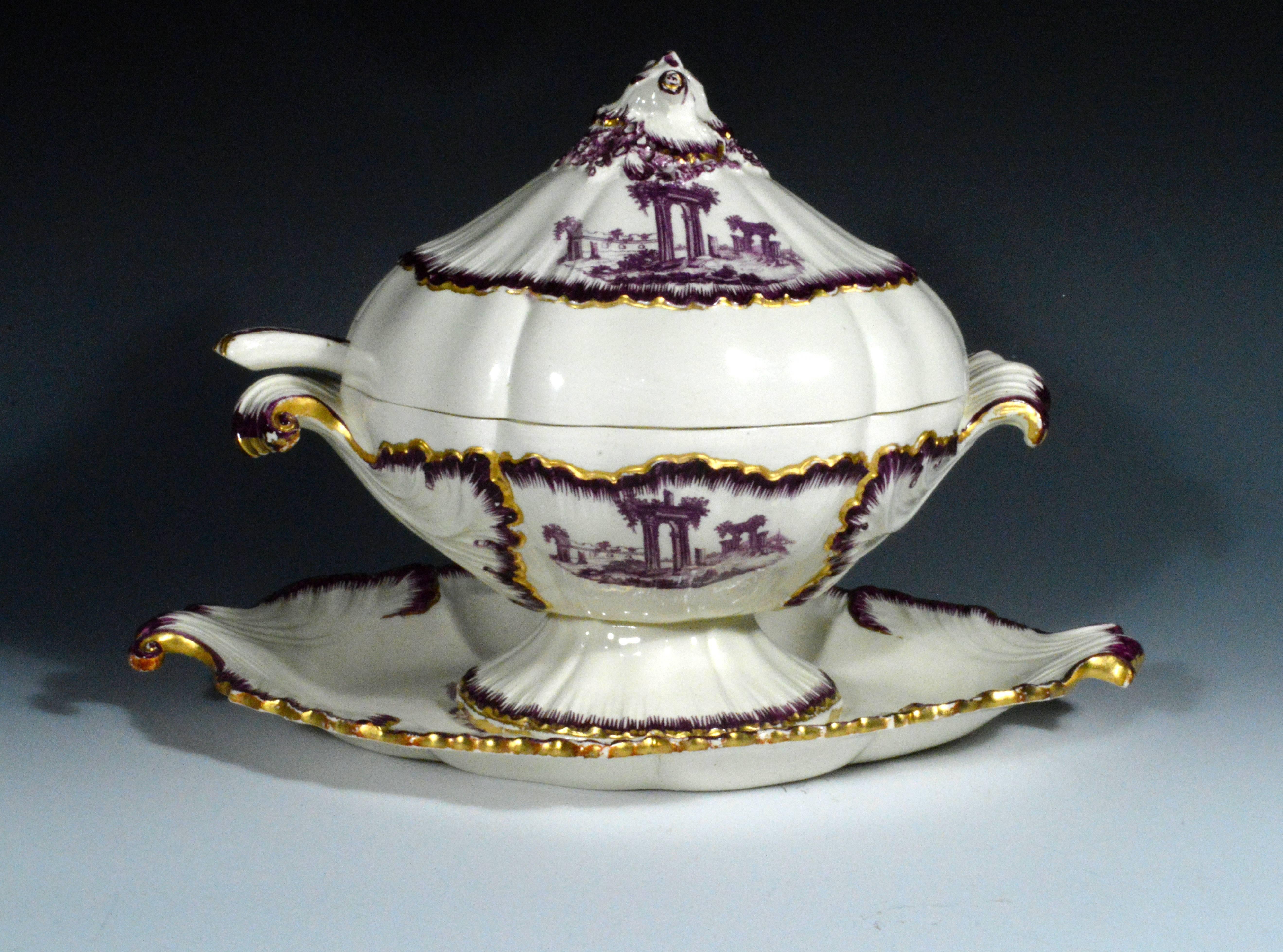 The large 18th century Neale & Co. creamware sauce tureen, cover, stand and ladle are each decorated in puce transfer with figures amongst classical ruins. The rims also with a painted shell-edge puce border highlighted with the strong remnants of