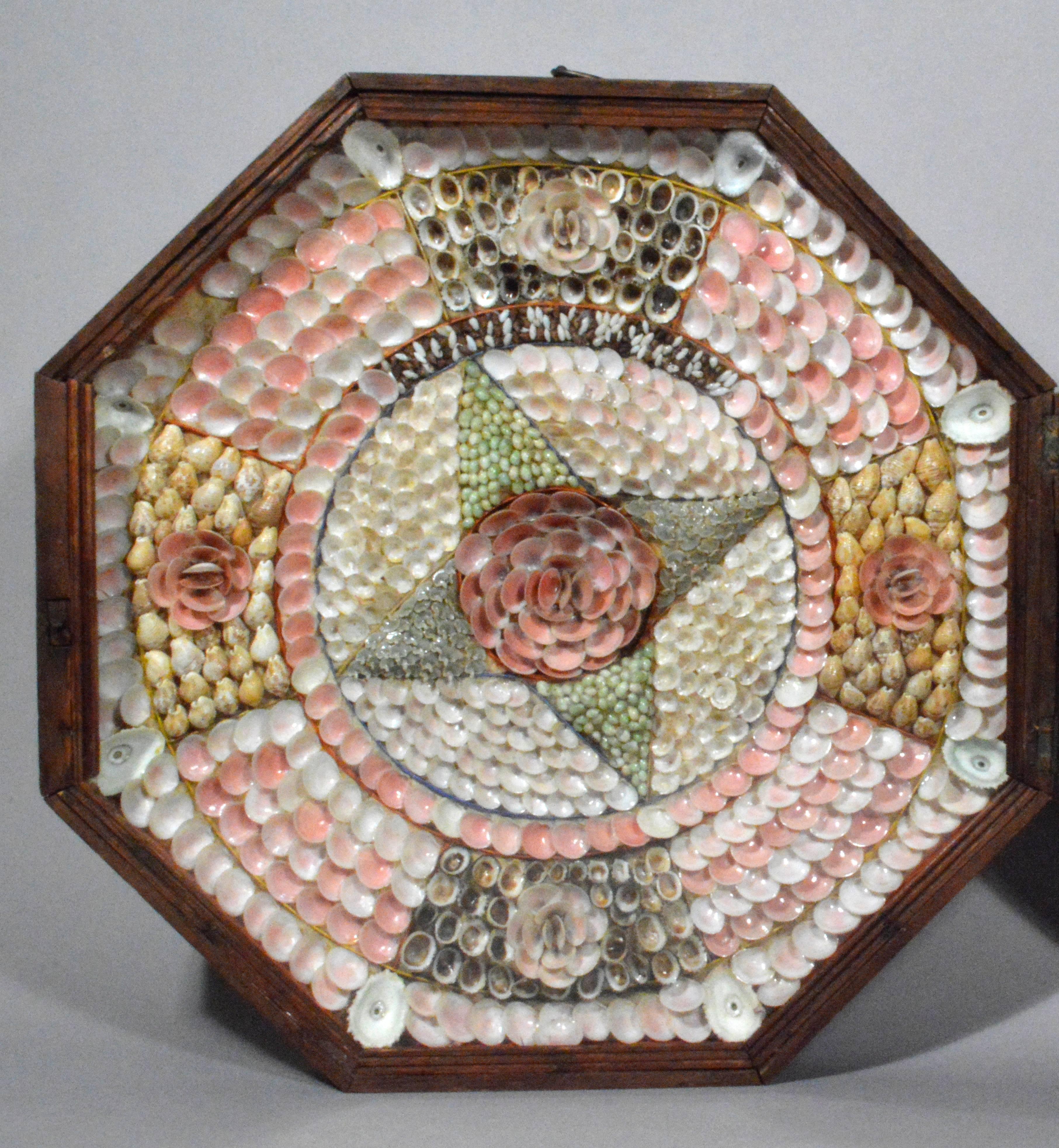 The large sailor's valentine made of shells from Barbados has on the left side a star for with the unusual motto Home to Stay above. To the right is a heart shape with a rose above.

A sailor's valentine is a form of shellcraft, a type of mostly