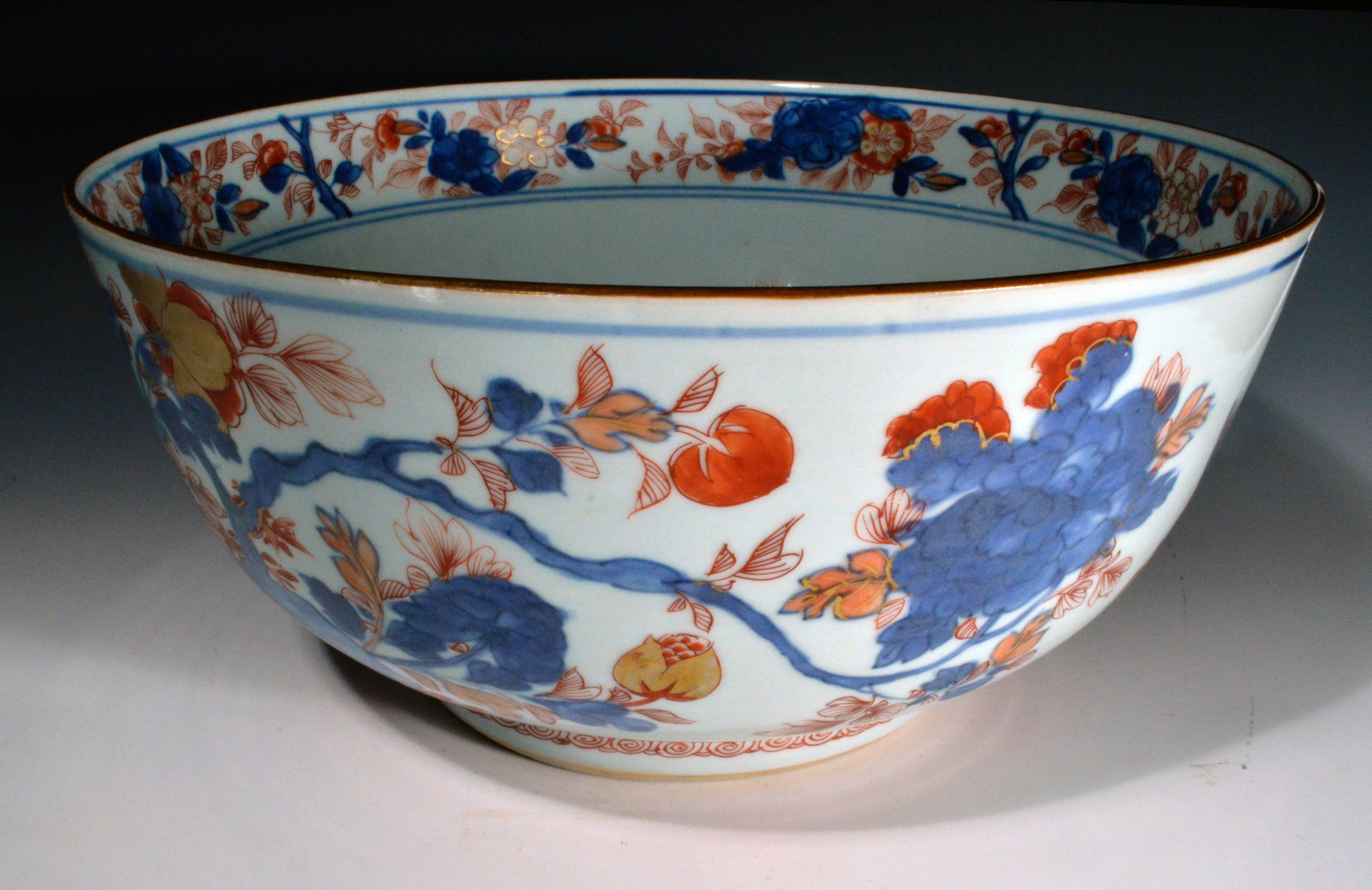 Chinese Export Porcelain high-sided bowl is decorated in Imari colours of iron red and underglaze blue with gilt highlights with birds amongst flowering plants and blue rockwork.

Provenance: Old Shreve, Crump & Low blue paper label.