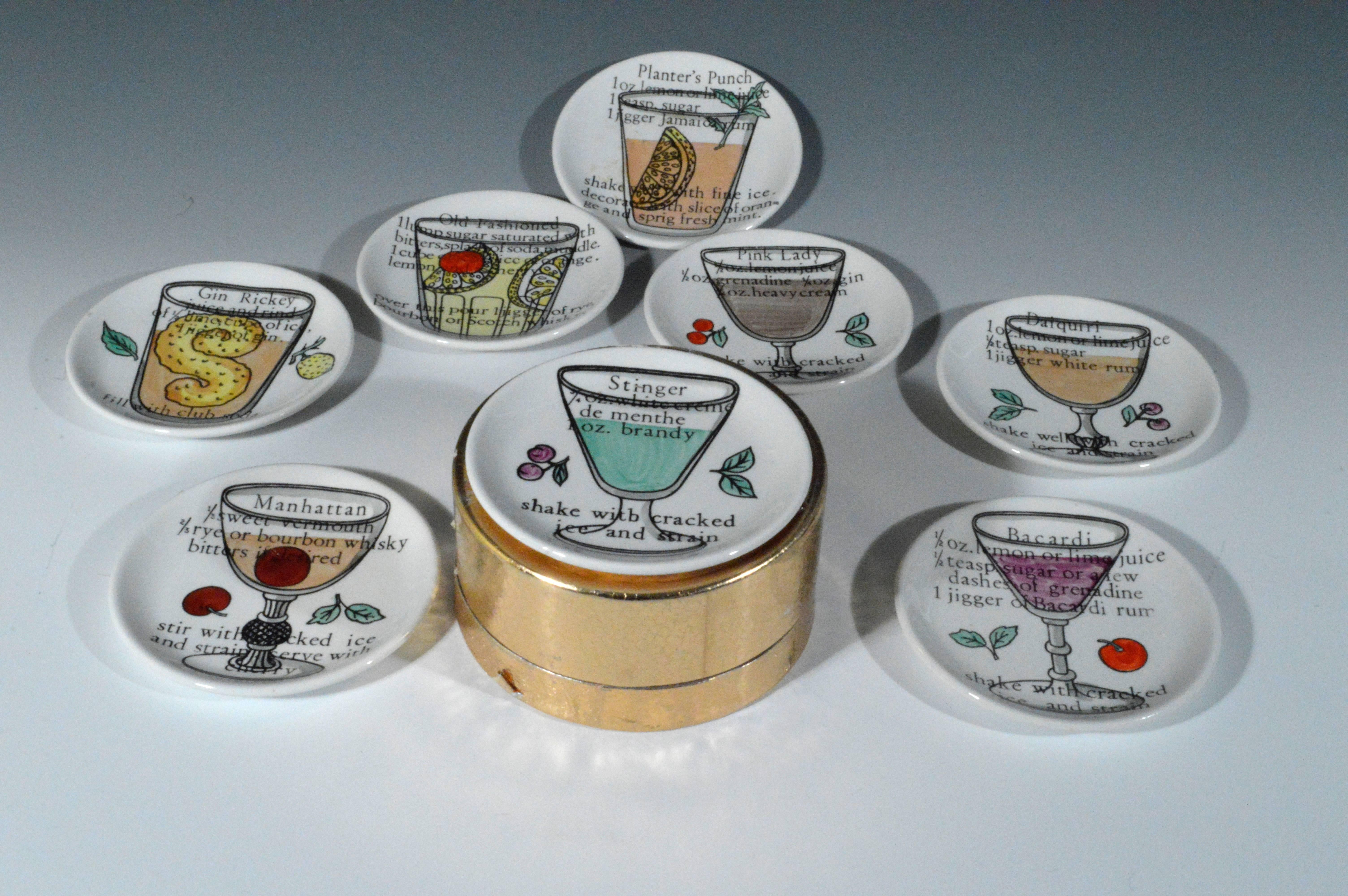 A complete set of eight vintage Piero Fornasetti large coasters which are each decorated with a different cocktail drink with original Fornasetti plate separators and gold box.

Reference: Fornasetti: The Complete Universe, Barnaba Fornasetti,