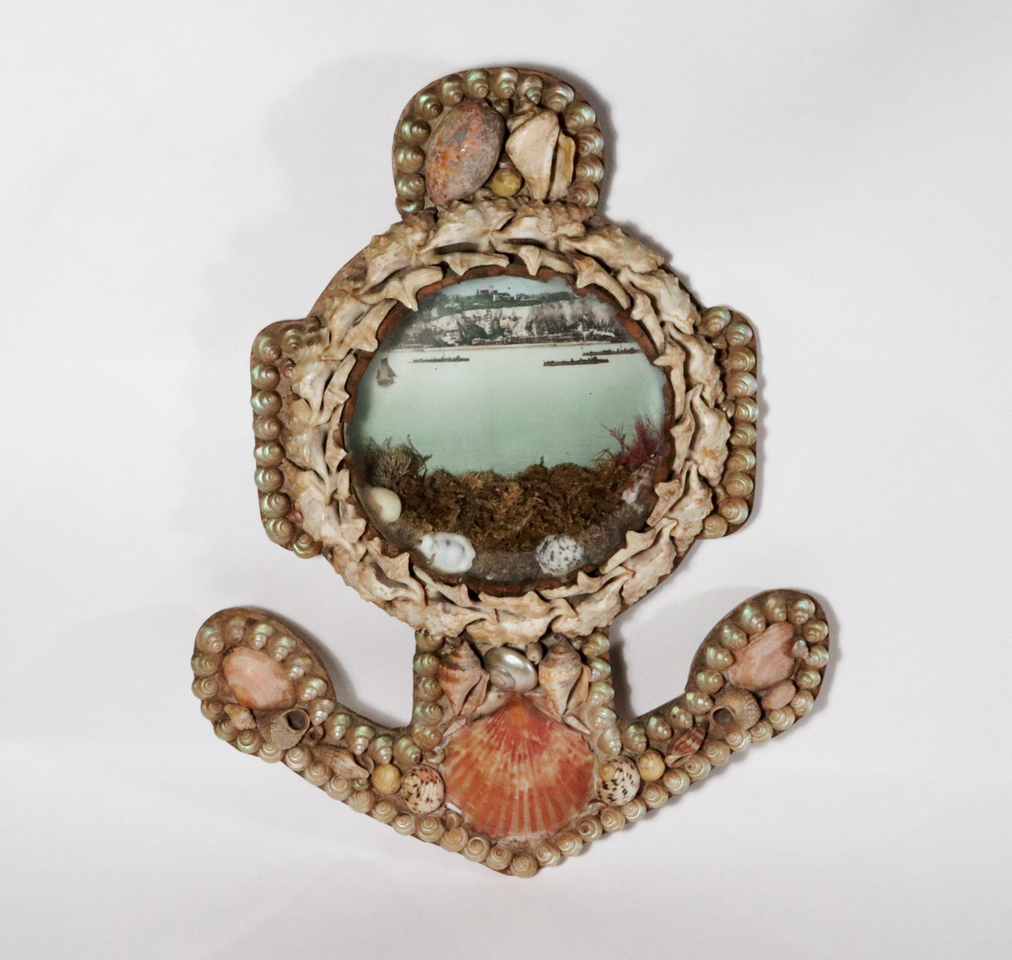 Edwardian Shell Valentine- Anchor-shaped Diorama-Ships off Coast

A large Edwardian shellwork diorama with bevelled glass in the form of an anchor. The diorama features a chromolithograph of ships off the coast of Dover with the iconic white cliffs