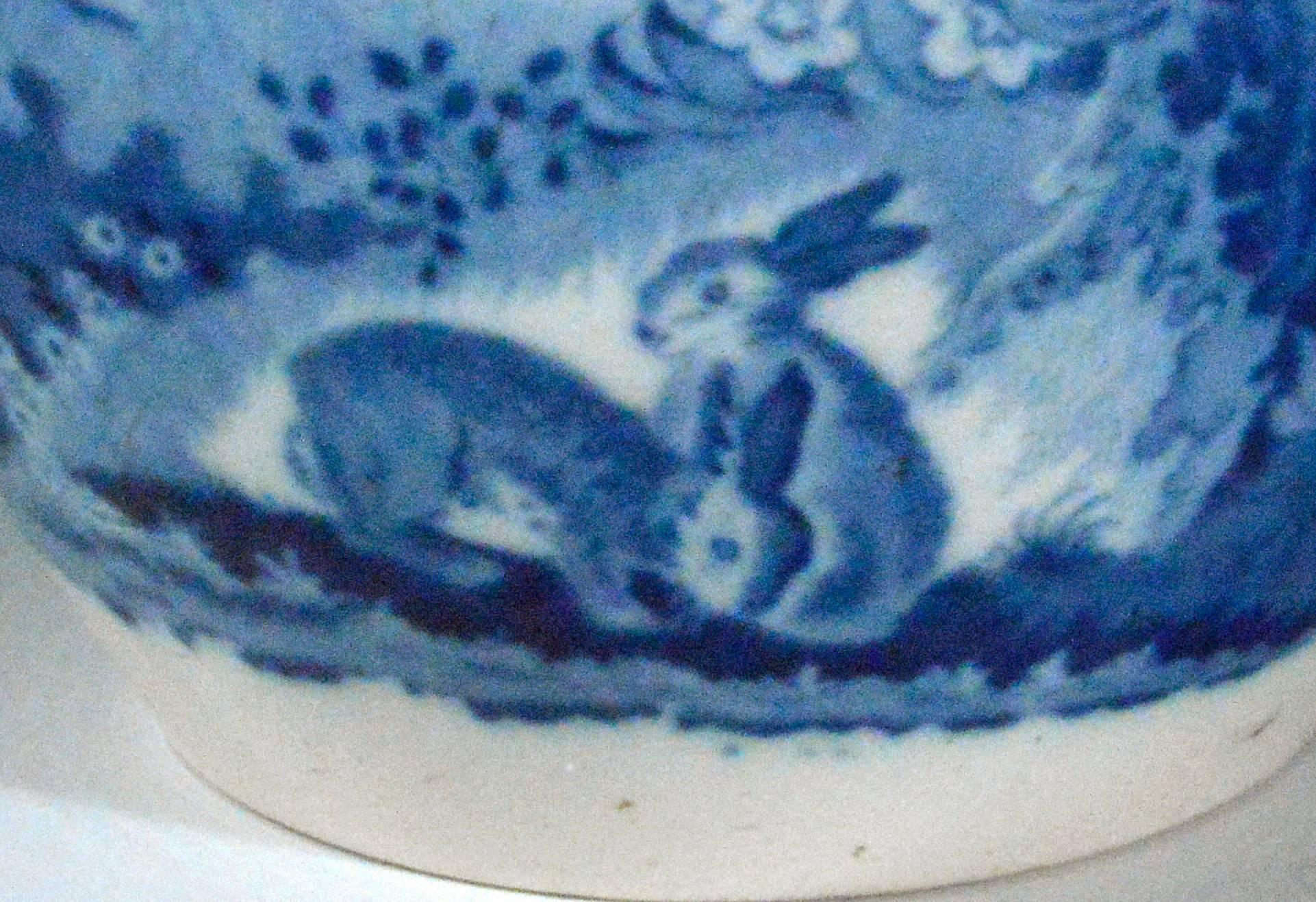 The printed Staffordshire blue and white jug shows rabbits in a landscape.


 