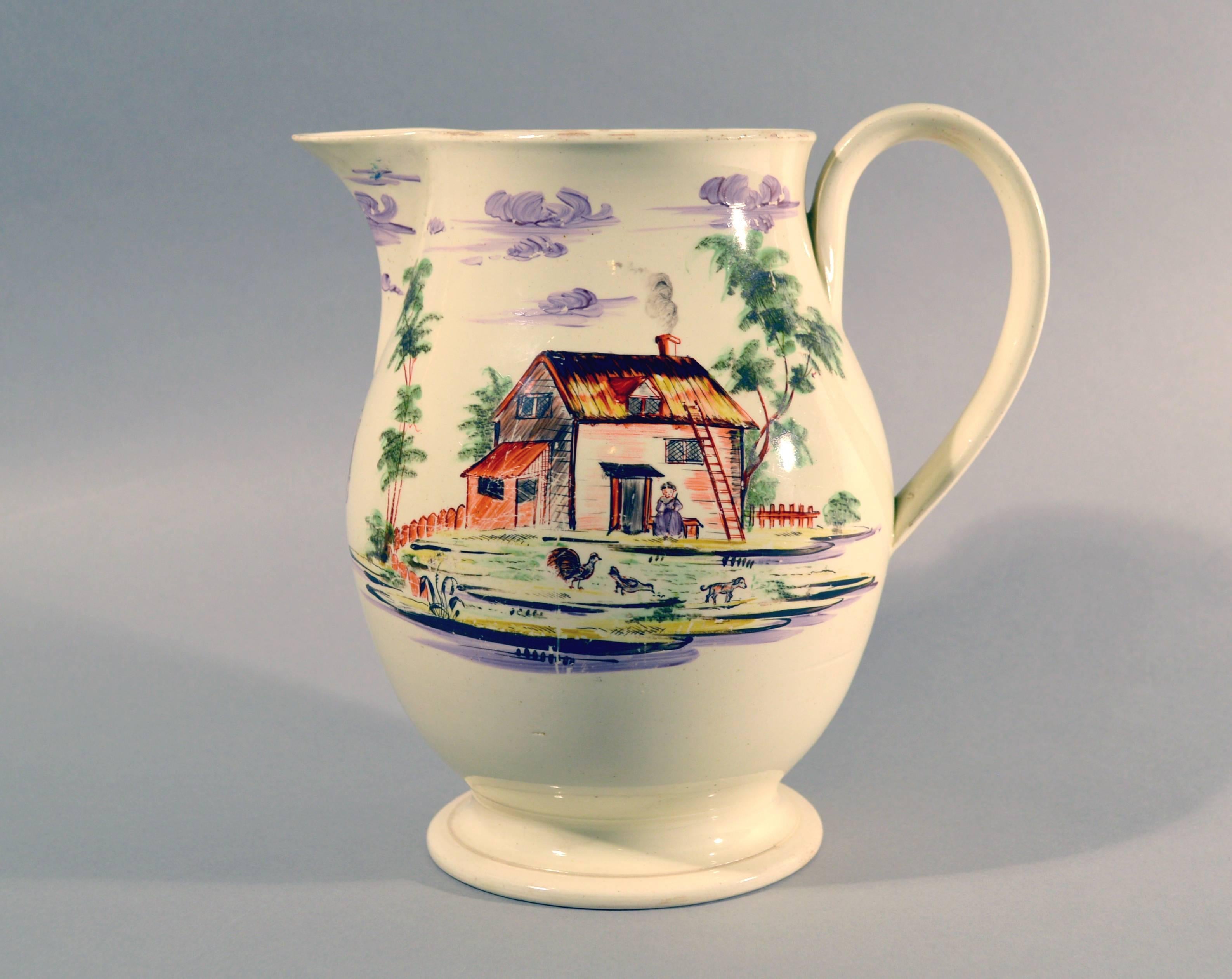 English creamware large jug decorated with farm buildings and farm animals,
Staffordshire or Yorkshire,
circa 1785.

This charming creamware pottery jug is hand-painted on each side with different rural farm scenes. To one side is a large house