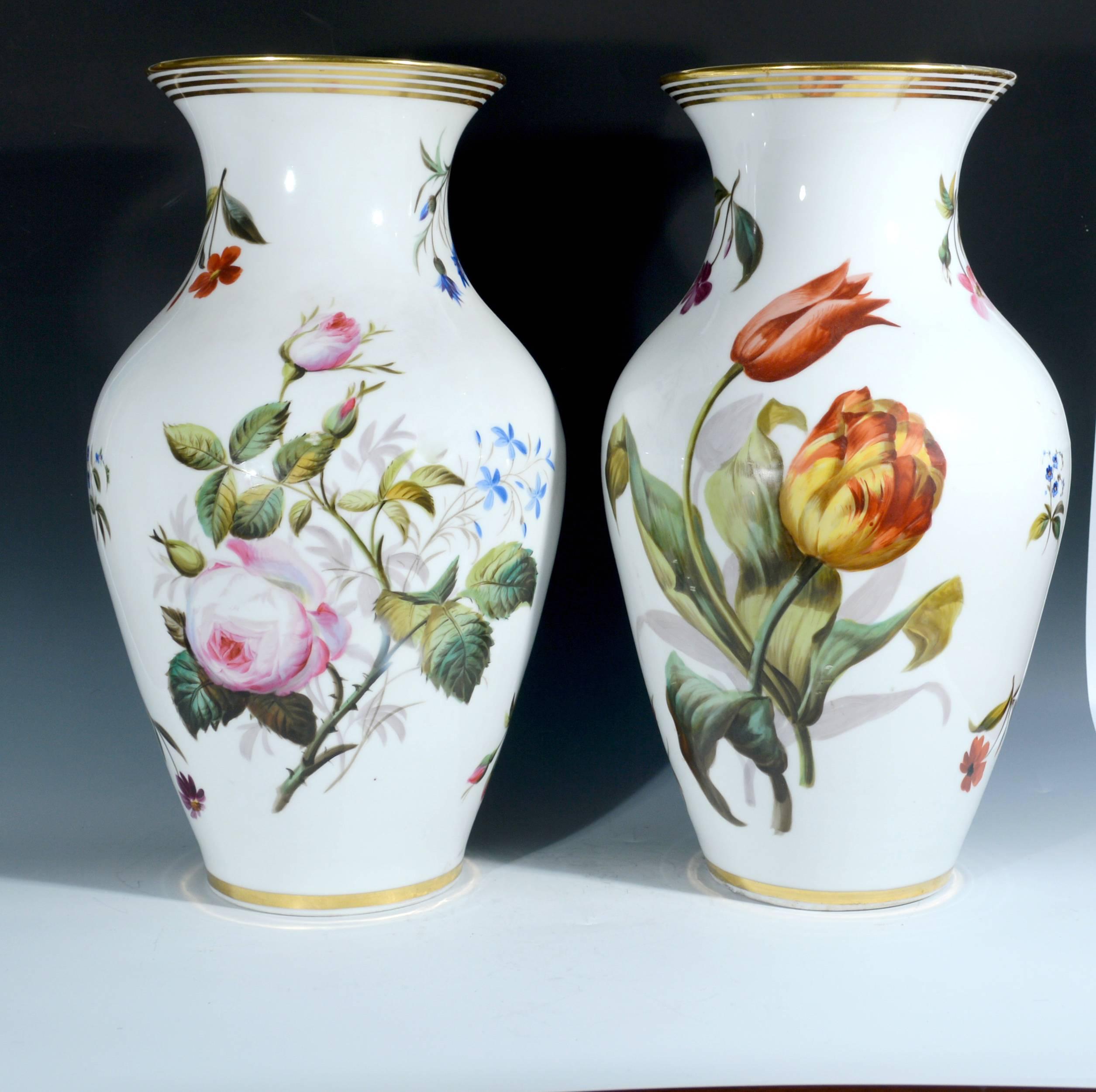 Pair of Paris porcelain botanical vases,
Mid-19th century.

Each of the baluster form vases has a cylindrical neck and everted rim and is painted with floral bouquets on a white ground. On the reverse, each has a large single-flower specimen.