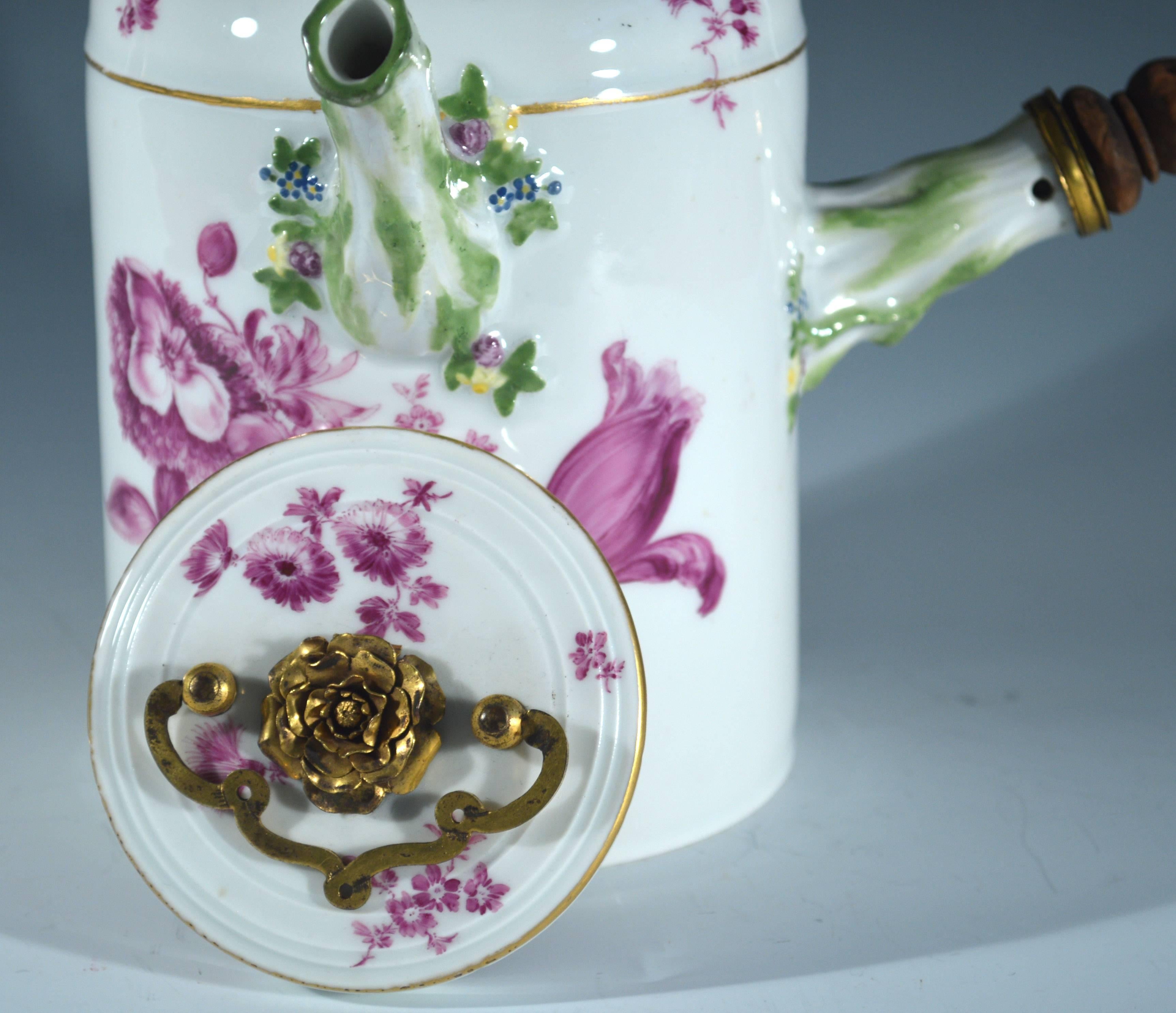 Meissen gilt-metal mounted porcelain chocolate pot and cover,
circa 1760

The large Meissen Porcelain chocolate pot has a leaf form handle with a wooden grip. The handle and spout moulded and painted as flowering stems. The body and cover well