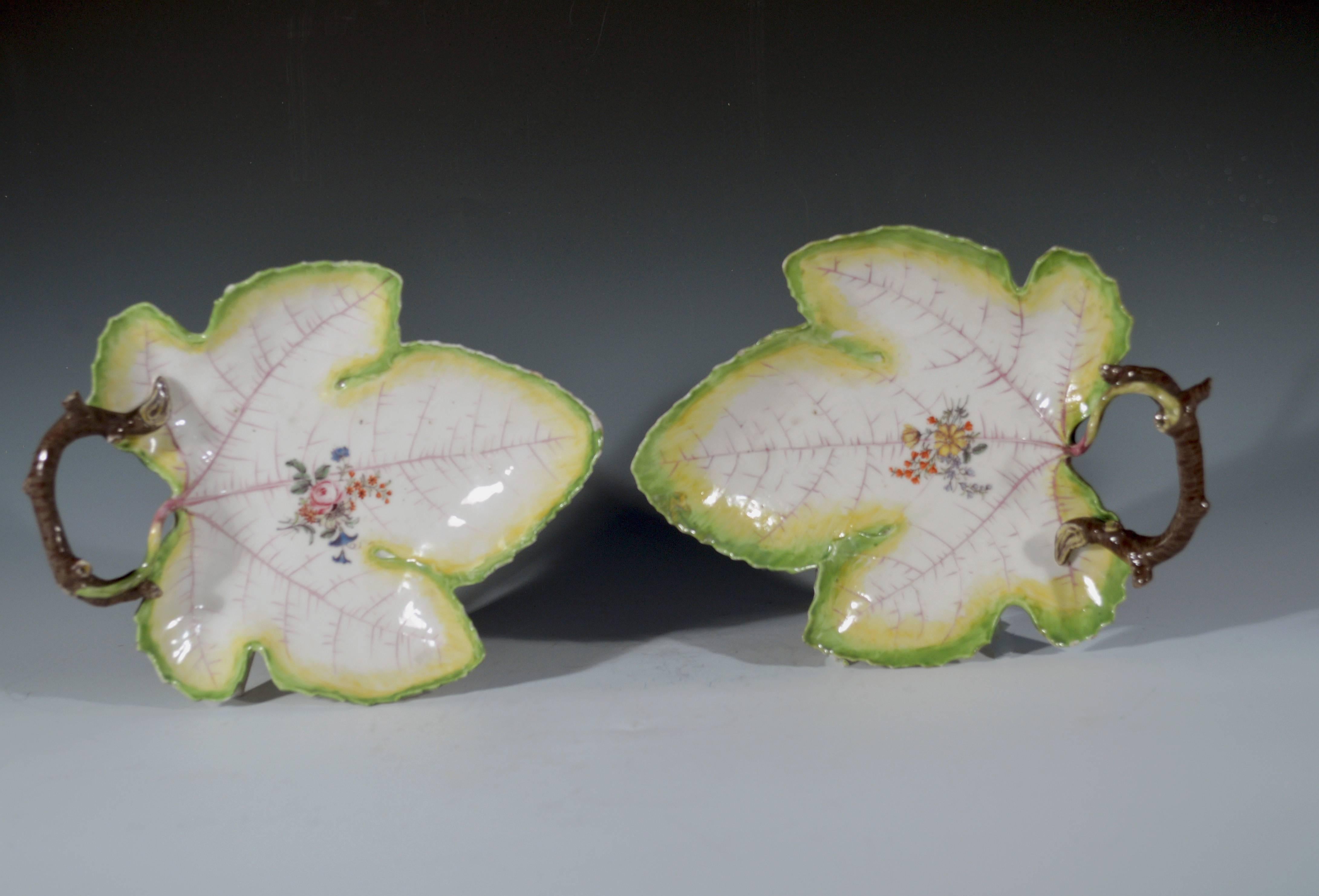 Chelsea porcelain pair of trompe L'oeil grape leaf dishes,
Red Anchor period,
circa 1755

The Chelsea porcelain dish is in the form of a grape leaf with serrated rim and is painted in the centre with a floral bouquet superimposed on a network of