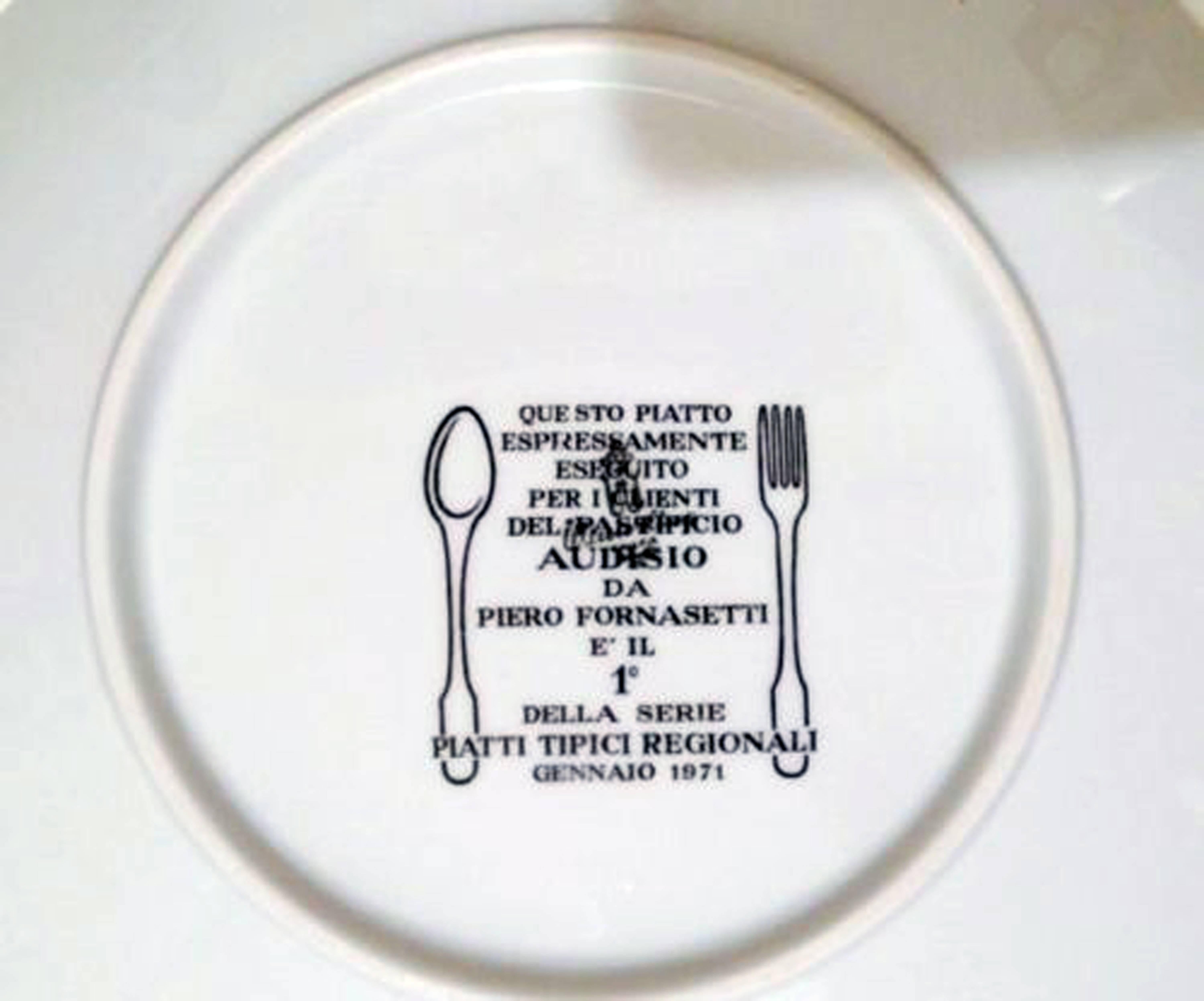 Piero Fornasetti Recipe Plate Piatti Tipici #1, 
For Pasta maker Audisio,
Gnocchi al Pomodoro,
1971.

This plate is from the first of a series of six plates made for the Audisio pasta company depicting typical Italian regional dishes.

The