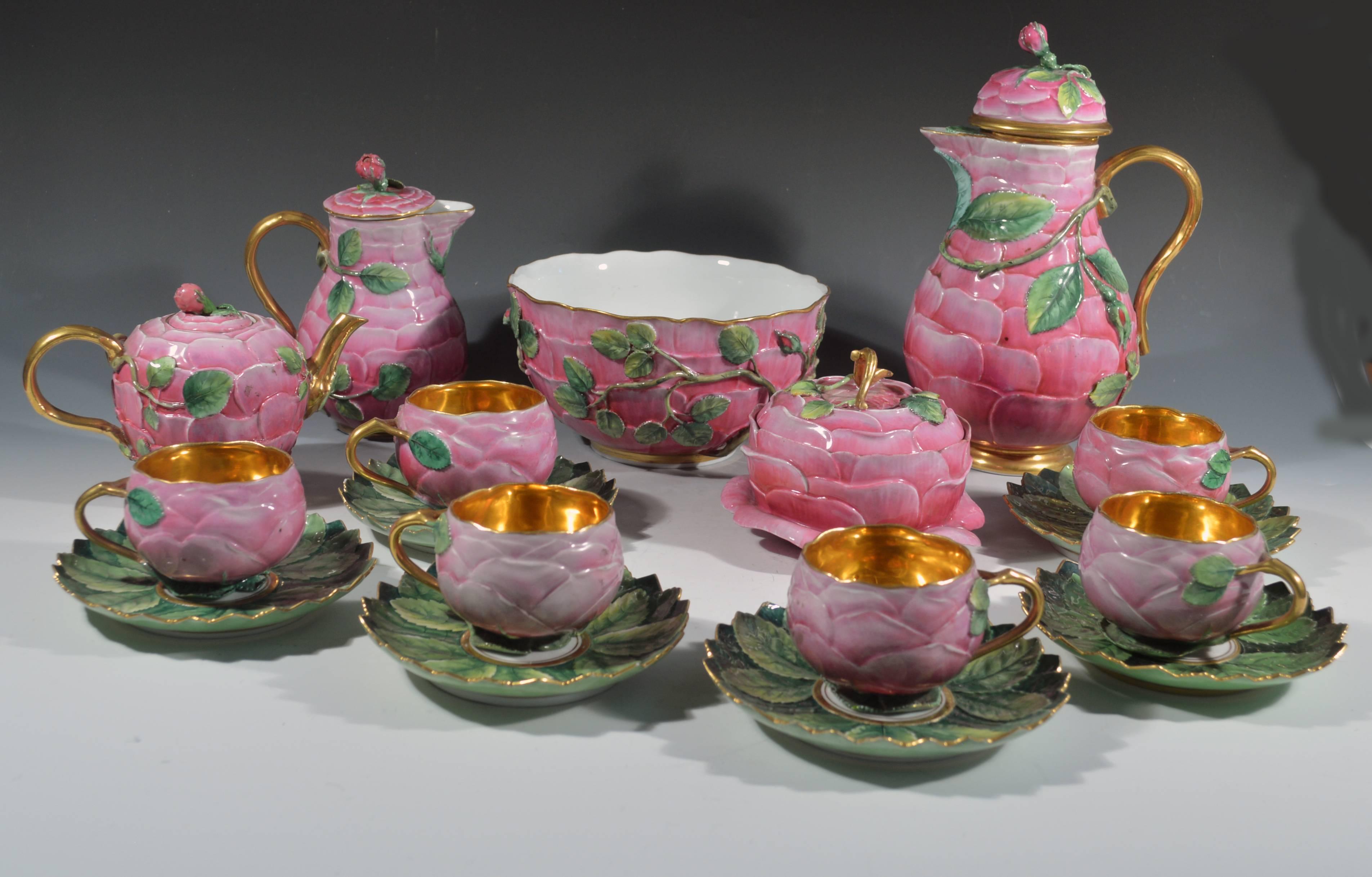 German porcelain Trompe L'oeil rose tea service,
19th century.

The tea service comprises of a hot water pot and cover, a teapot and cover, a hot milk jug and cover, a sugar bowl and cover and six cups and saucers with gilded interiors.