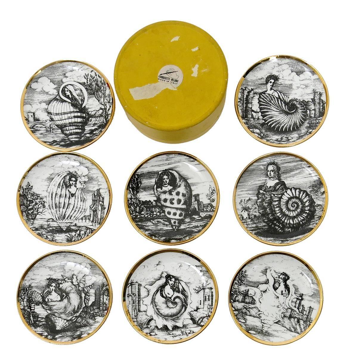 Piero Fornasetti vintage cocktail coasters in Oceanidi pattern with original box,
1950s.

Great early set of coasters with nautical theme. While we call these coasters, they were most likely for bar food like olives etc.

Reference: Fornasetti
