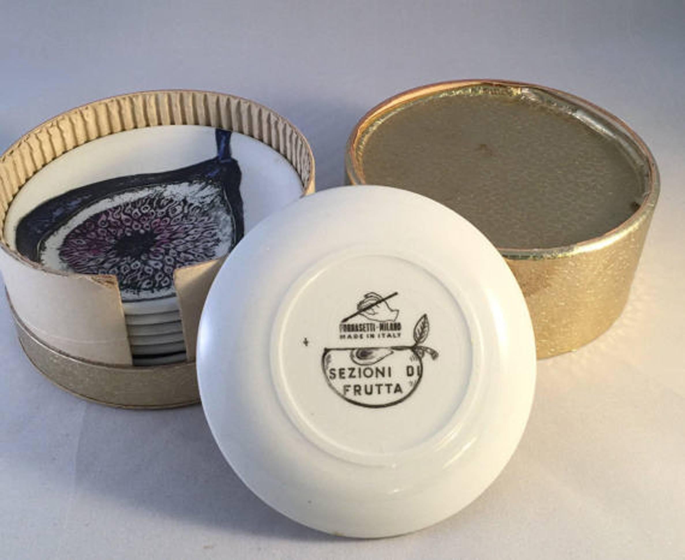 Piero Fornasetti boxed set of Sezione Di Frutta (Cut Fruit) Coasters, 
1960s.

This is a fantastic series with split views of different fruits depicted in rich color and detail with original gold box.

Reference: Fornasetti: The Complete