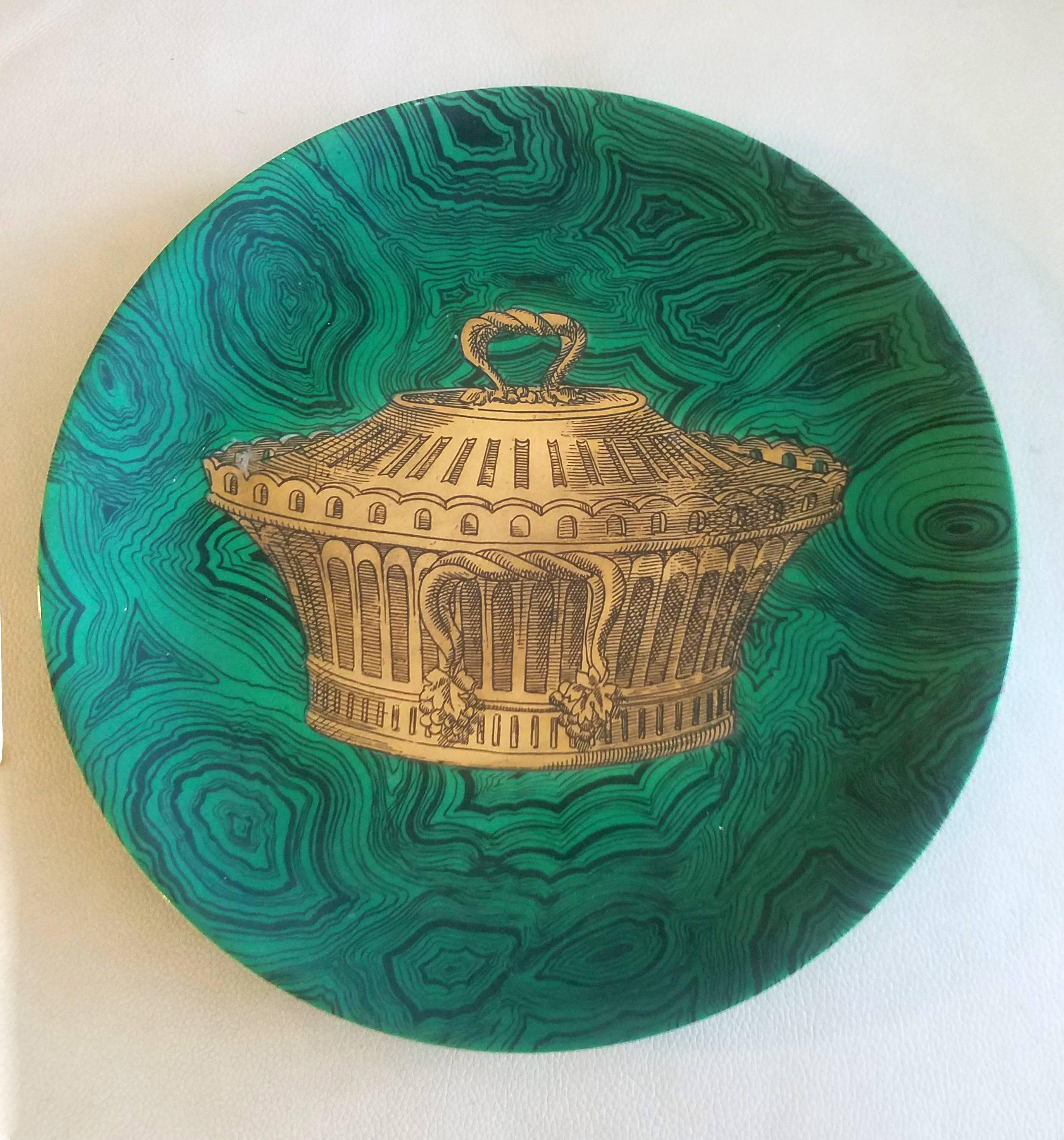 Piero Fornasetti 12 Stoviglie malachite plates,
1950s-1960s.

The 12 plates, numbered 1-12, each have a green malachite ground and are painted in gold with different gold forms used for serving food, tea, coffee and drinks.

Reference: