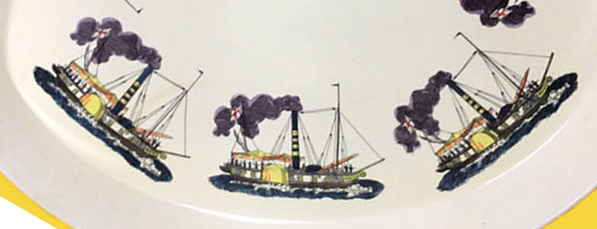 Piero Fornasetti metal steamboat tray, 
early 1950s.

An oval metal serving tray with high sides on a white ground with steamboats in the round. This is a rare Fornasetti subject.