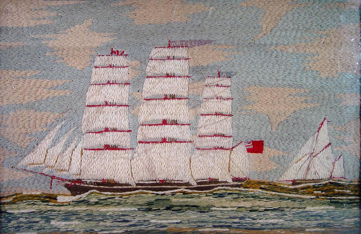 Sailor's Woolwork Woolie of The Tea Clipper, Ariel, 
Signed C. Ames, circa 1880

The Ariel sails from right to left in high sea having just past a smaller sailing yacht. The sea is in shades of green and white. The cloudy sky is a light blue. The