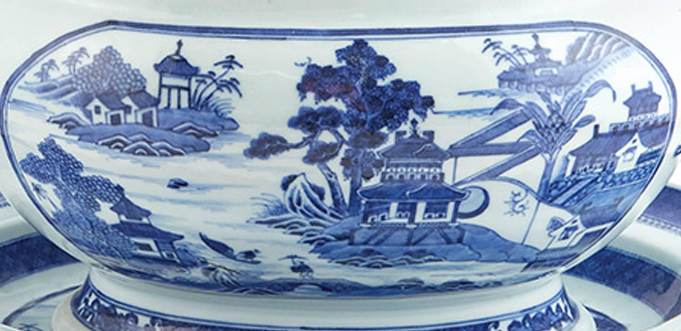 Chinese Export Nanking blue and white porcelain soup tureens, covers and stands, circa 1790-1820.

A superb pair of large Chinese Export porcelain underglaze blue tureens, covers and stands painted with Chinese landscapes and gardens within oval