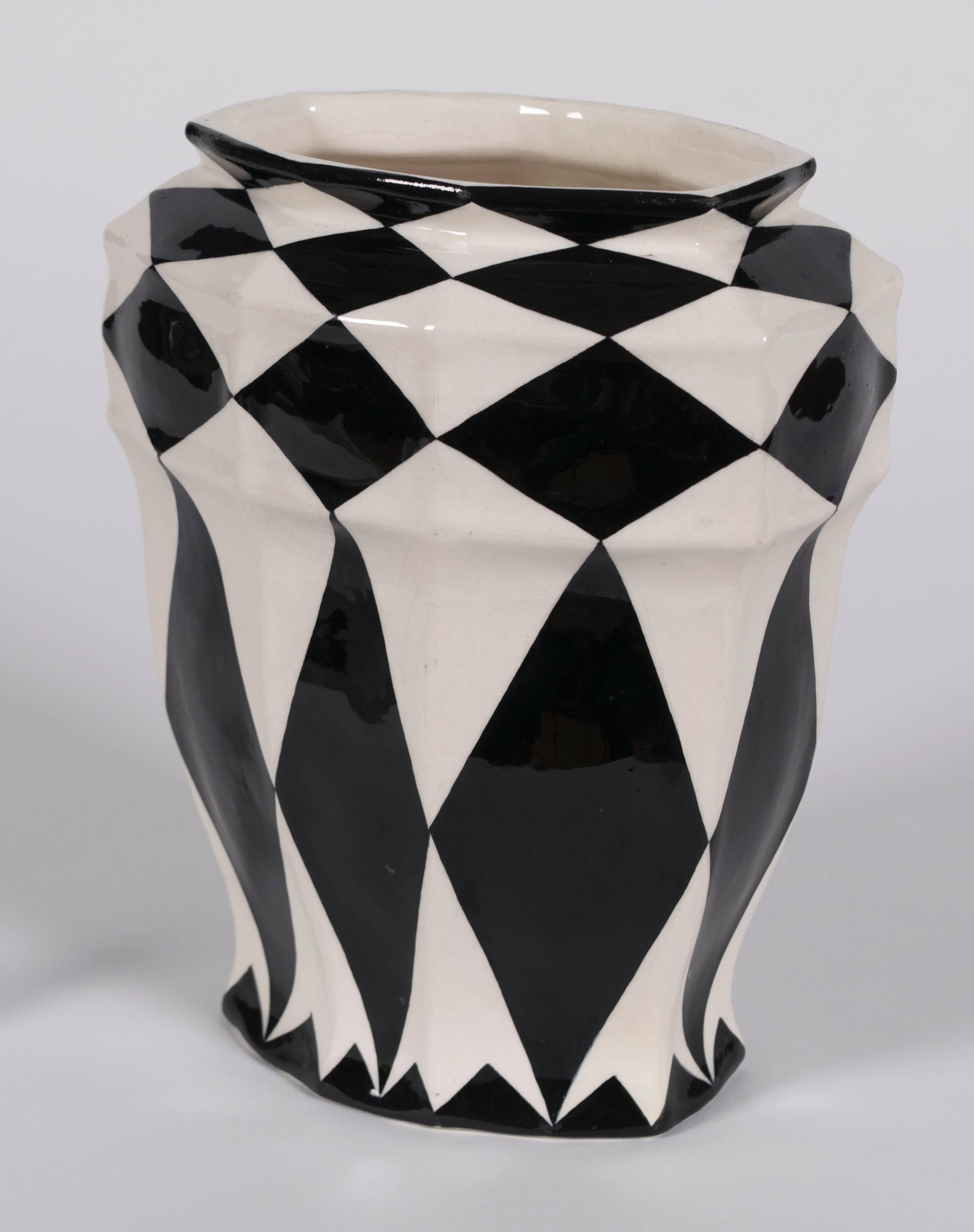 Austrian secession period ceramic vase by Keramos, circa 1925. Dramatic hand-painted black and white geometric form.

Keramos was a Viennese art pottery manufactory founded in 1910. The company was a silver medal winner at the Paris Art Exhibition