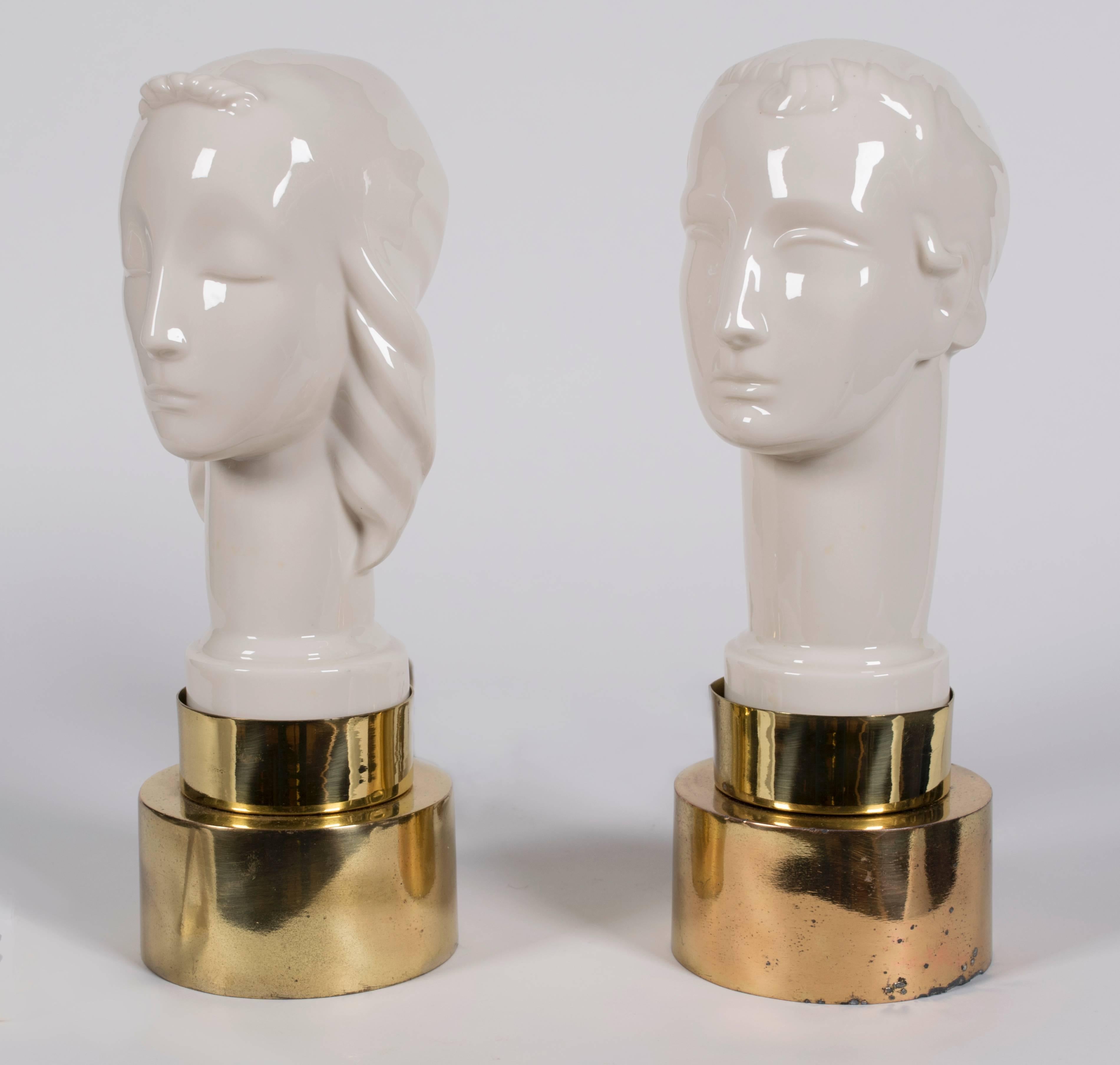 A pair of American Art Deco period glazed ceramic male/female bust lamps manufactured by Lenox under the direction of Frank Graham Holmes, circa 1930.
The Lenox company was founded in New Jersey in 1889. Frank Graham Holmes was the company's chief