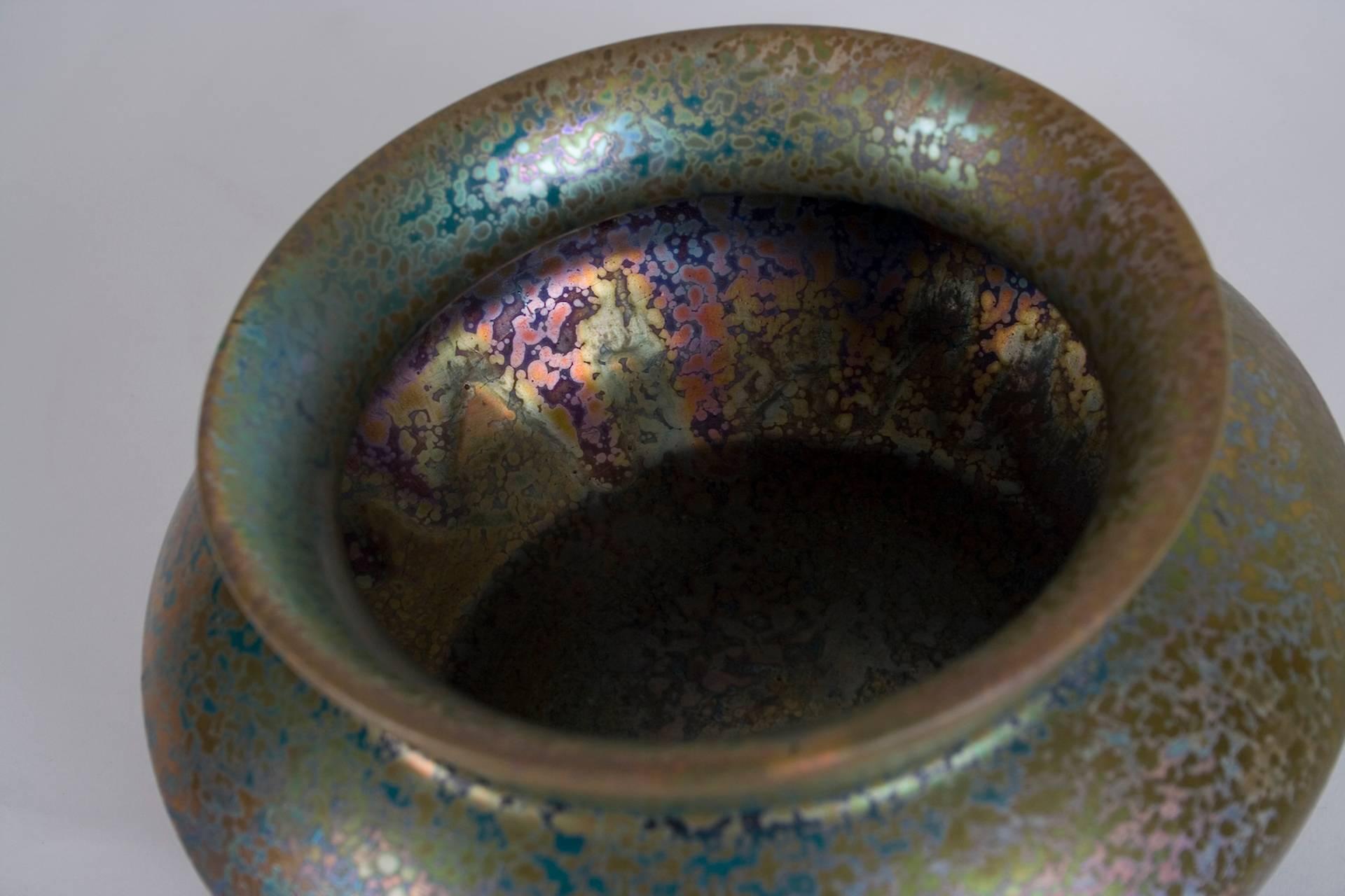 A French Art Nouveau period bowl by Clement Massier, circa 1900. Unusual Grecian form with brilliant textured iridescent glaze. 

Massier (1845-1917), member of a family dynasty of potters, is credited with reviving the ceramics industry in