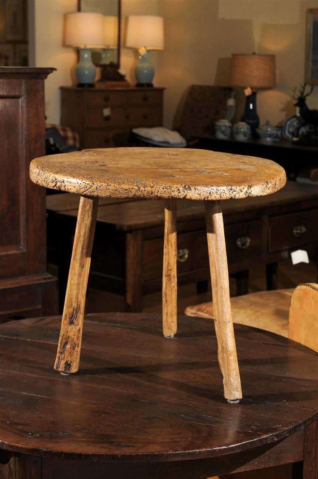 This beautiful, Sycamore, side table evokes warmth and character. It has a 2 inch thick top with three legs.