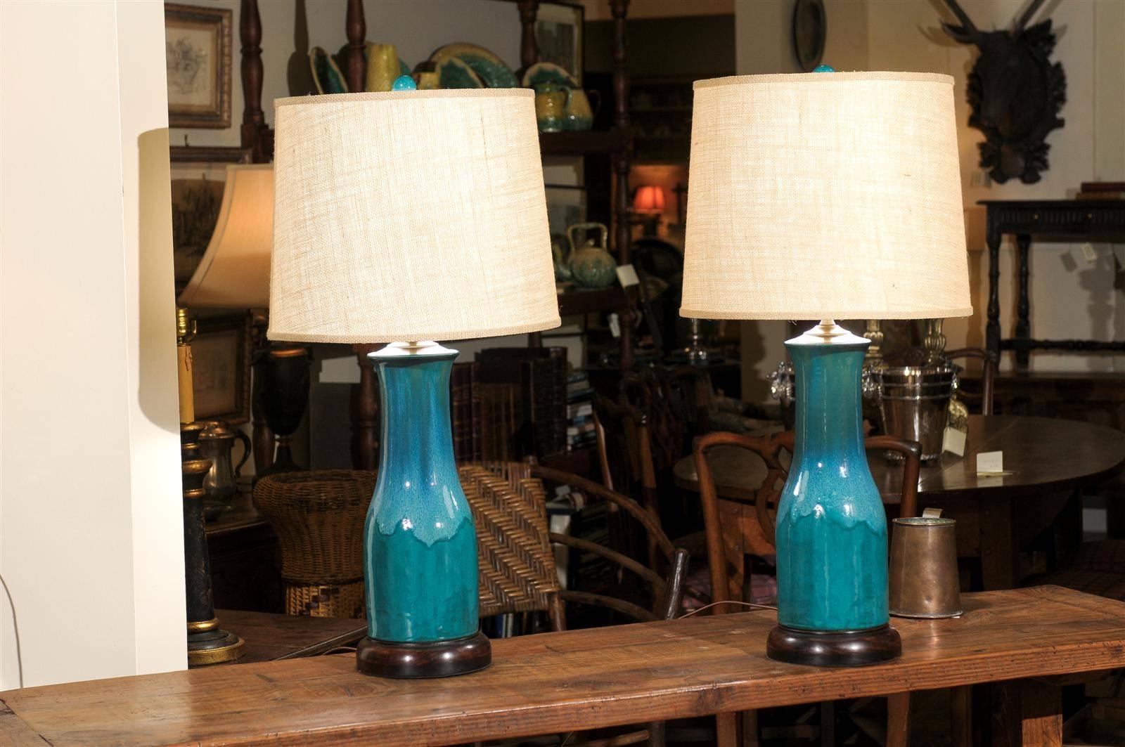 This pair of Aqua pottery lamps are made by North Georgia artist, Charlie West. 
Charlie has been a Potter since 1986. One of the beauties of his handmade lamps is that each piece is unique. These lamps can be ordered in additional colors. Please