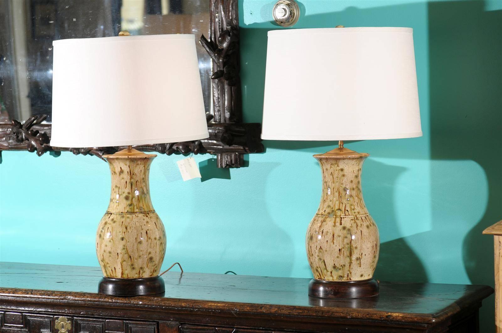 This beautiful pair of lamps are made in North Georgia by local artist Charlie West. Charlie started his work as a potter in 1986. The beauty of his lamps is that each piece is unique. Each lamp is hand glazed with a matching finial. Additional