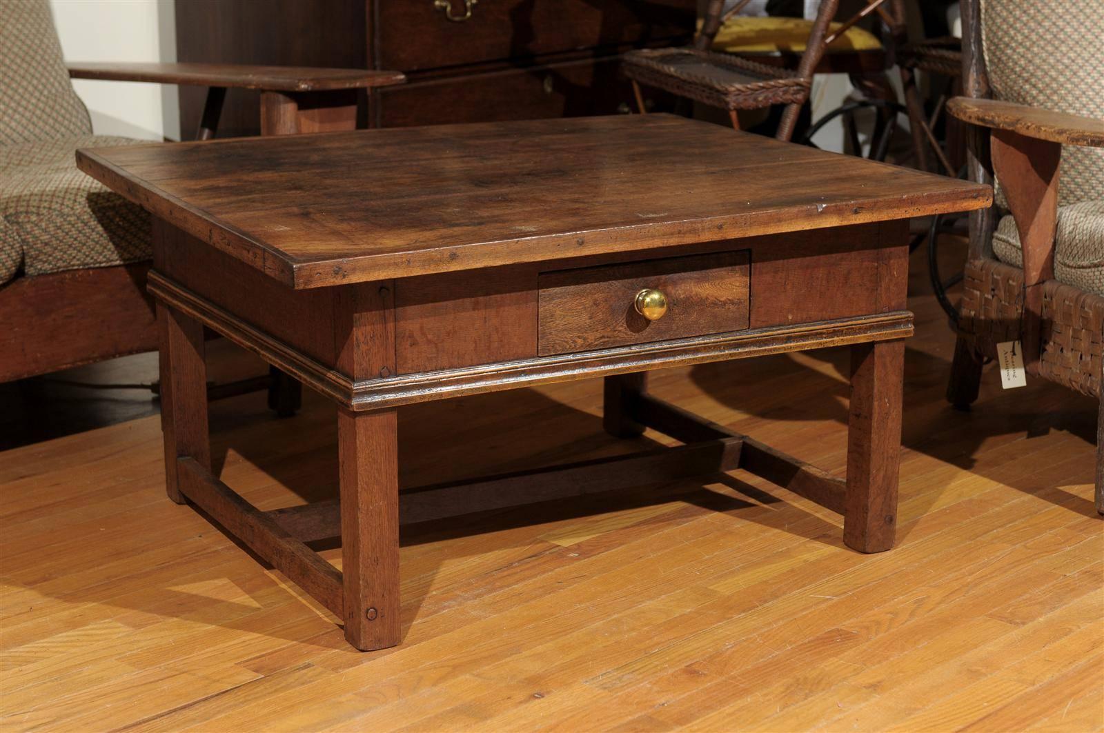This beautiful table was a Bavarian pub table that was cut down to make a coffee table. The top is walnut and the original base is oak. There is one drawer with a brass knob.
 