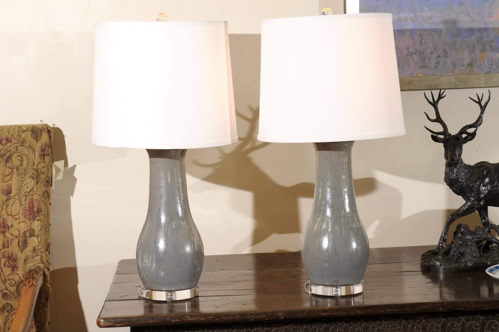 These lamps are made by North Georgia Potter, Charlie West. The lamps come in other shapes and sizes. The shades are included with this pair of lamps. Each lamp is hand thrown and glazed by the potter.
 