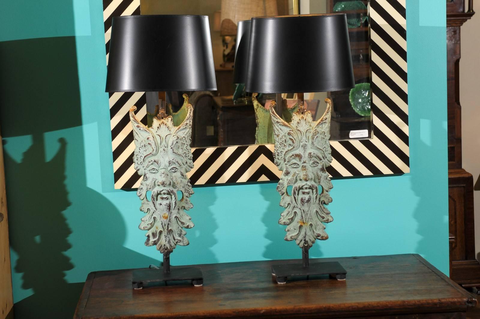 These decorative lamps were made from architectural elements. The mask lamps would look great with any style and could be used in a variety of rooms in your home.