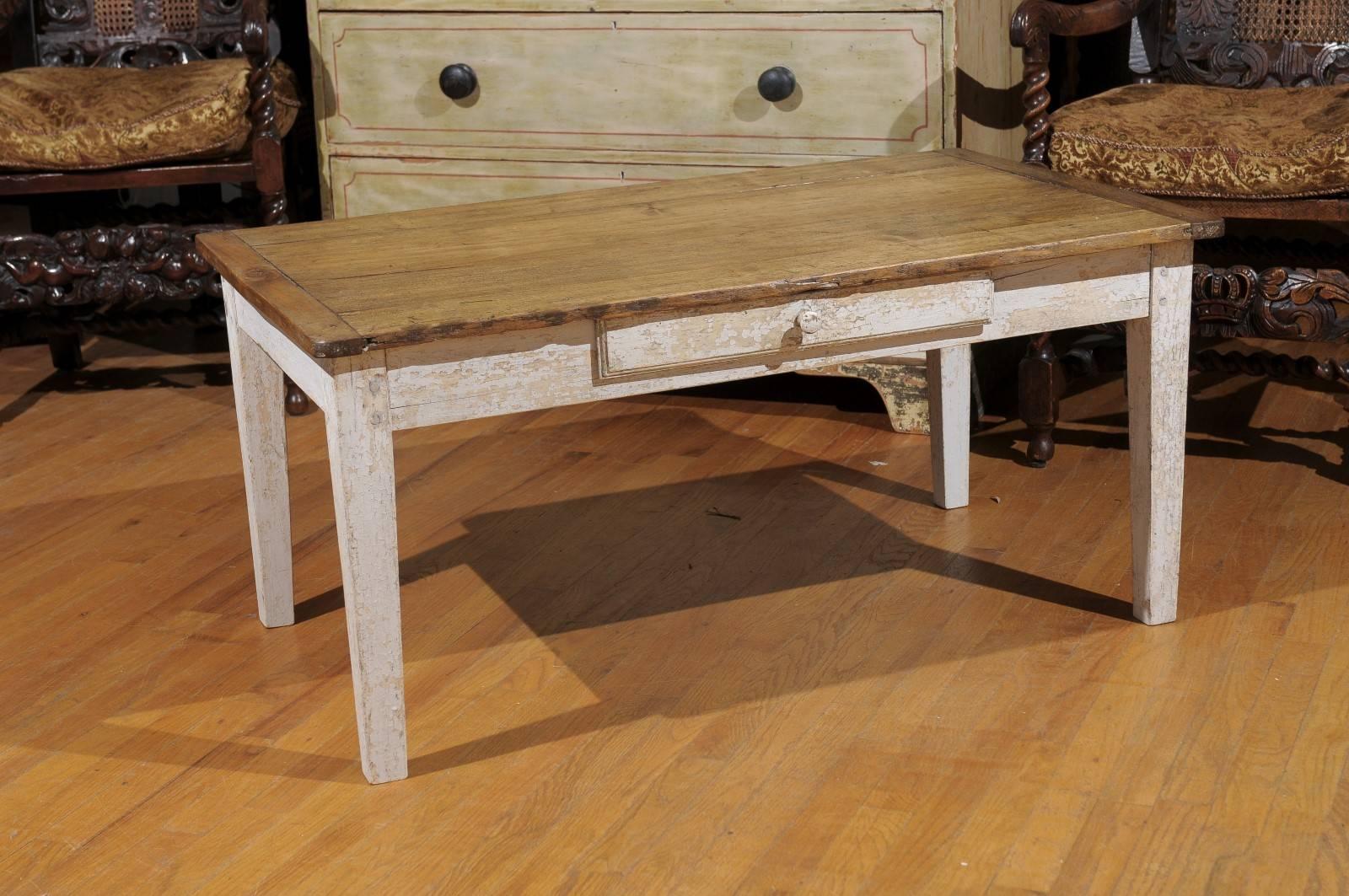 This French coffee table has a pine top with a single drawer. It is durable but very charming and would go well in most home decor styles.