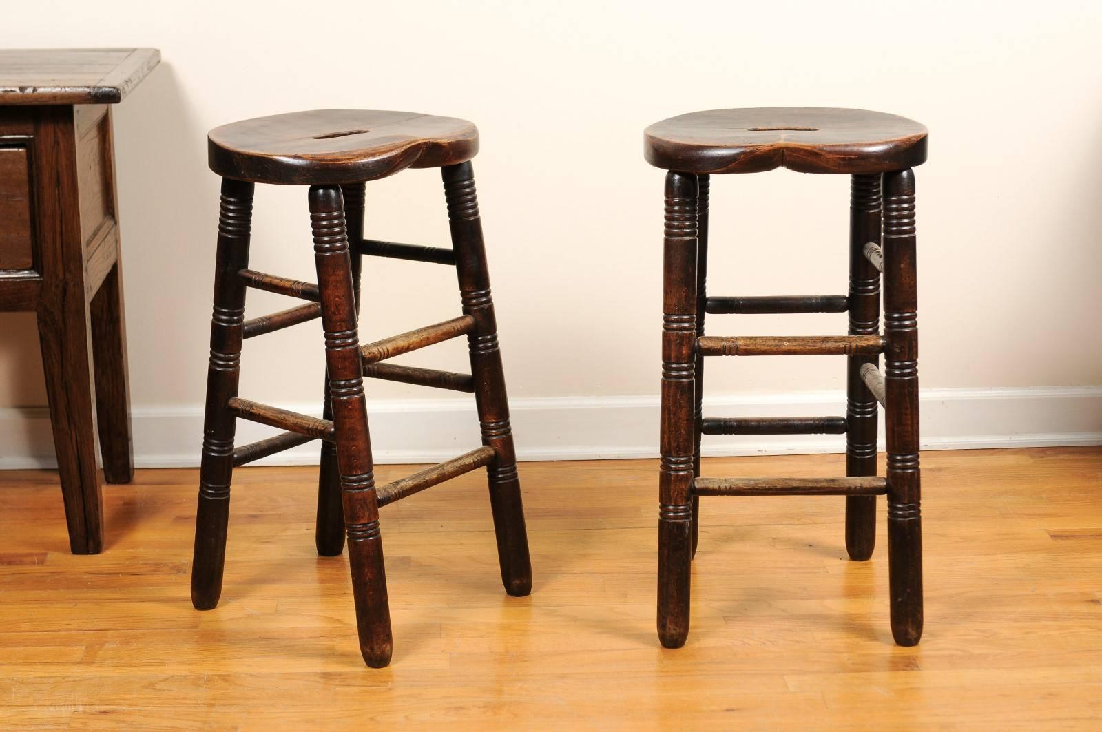 These stools are made to be used at a kitchen bar or another situation that needs a stool 28.5" in height. They were used in schools and also pubs in England. The shape of the seat makes it very comfortable.