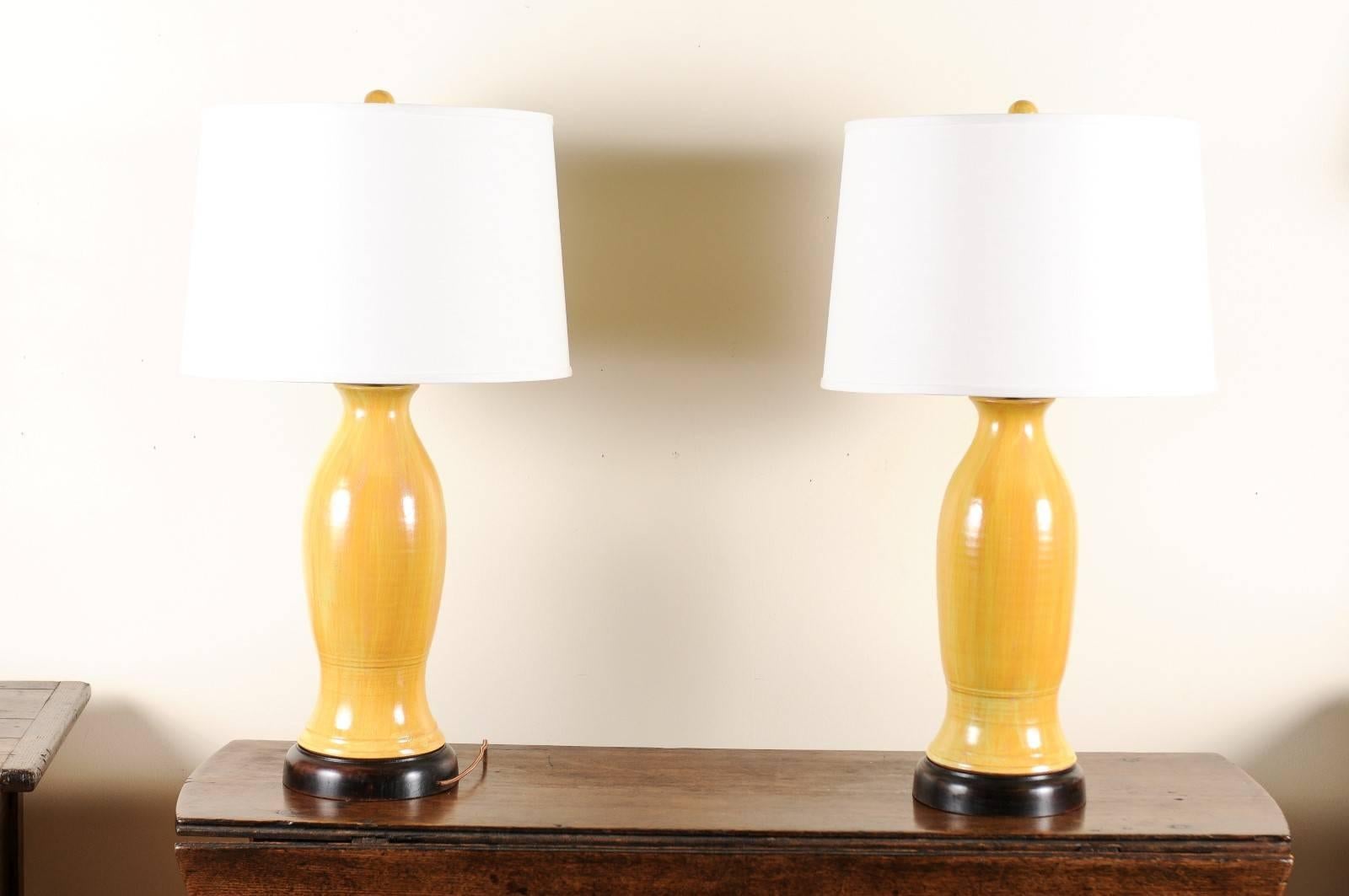 This unique hand-turned and glazed lamp is created by Charlie West, a noted North Georgia potter since 1986. They are mounted on a wooden base which is hand-turned on a wood lathe. Each of his lamps are original. These lamps can be ordered as a