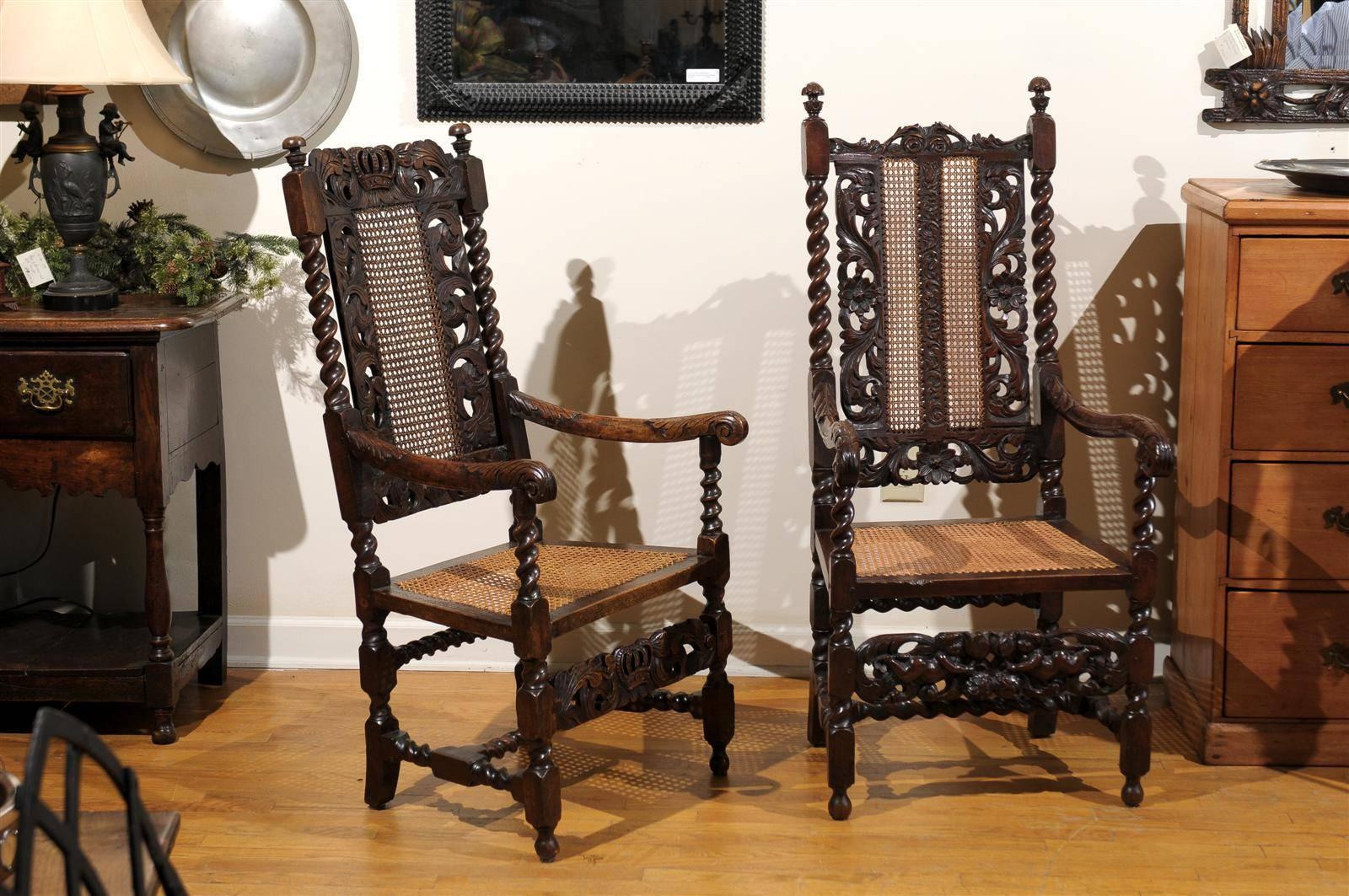 This beautiful pair of carved Barley twist arm chairs differ only slightly in their details. "Hers" is 1 " taller with a pair of rosettes on the  center back. This chair has more incising with two panels of caning on the back and a