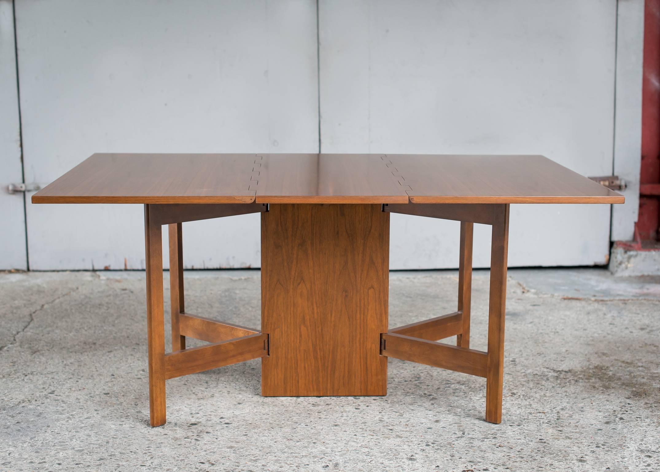 Vintage George Nelson Walnut Gateleg Dining Table for Herman Miller, 1950
Handsome double drop leaf table in rich walnut with solid wood base. 
Herman Miller Catalog #4656.
Classic Nelson design serves as solid dining table with stable base and