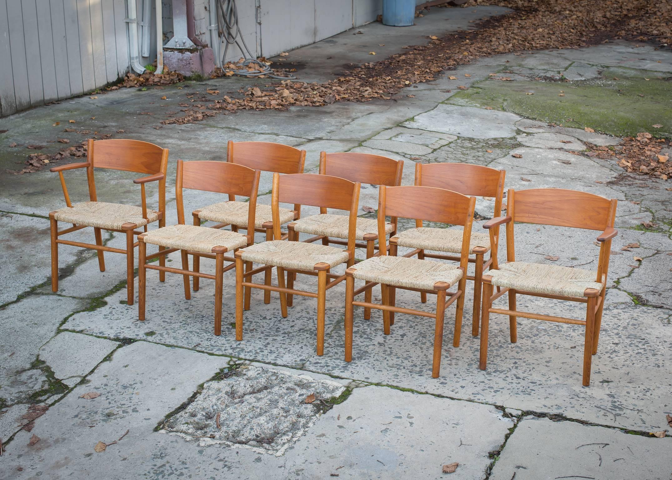 Vintage Børge Mogensen set of eight grass seat dining chairs consisting of six side chairs and two captains.
Fully restored set of classic Danish dining chairs by Børge Mogensen (1914-1972).
New grass seats on solid teak/oak frames newly stripped,