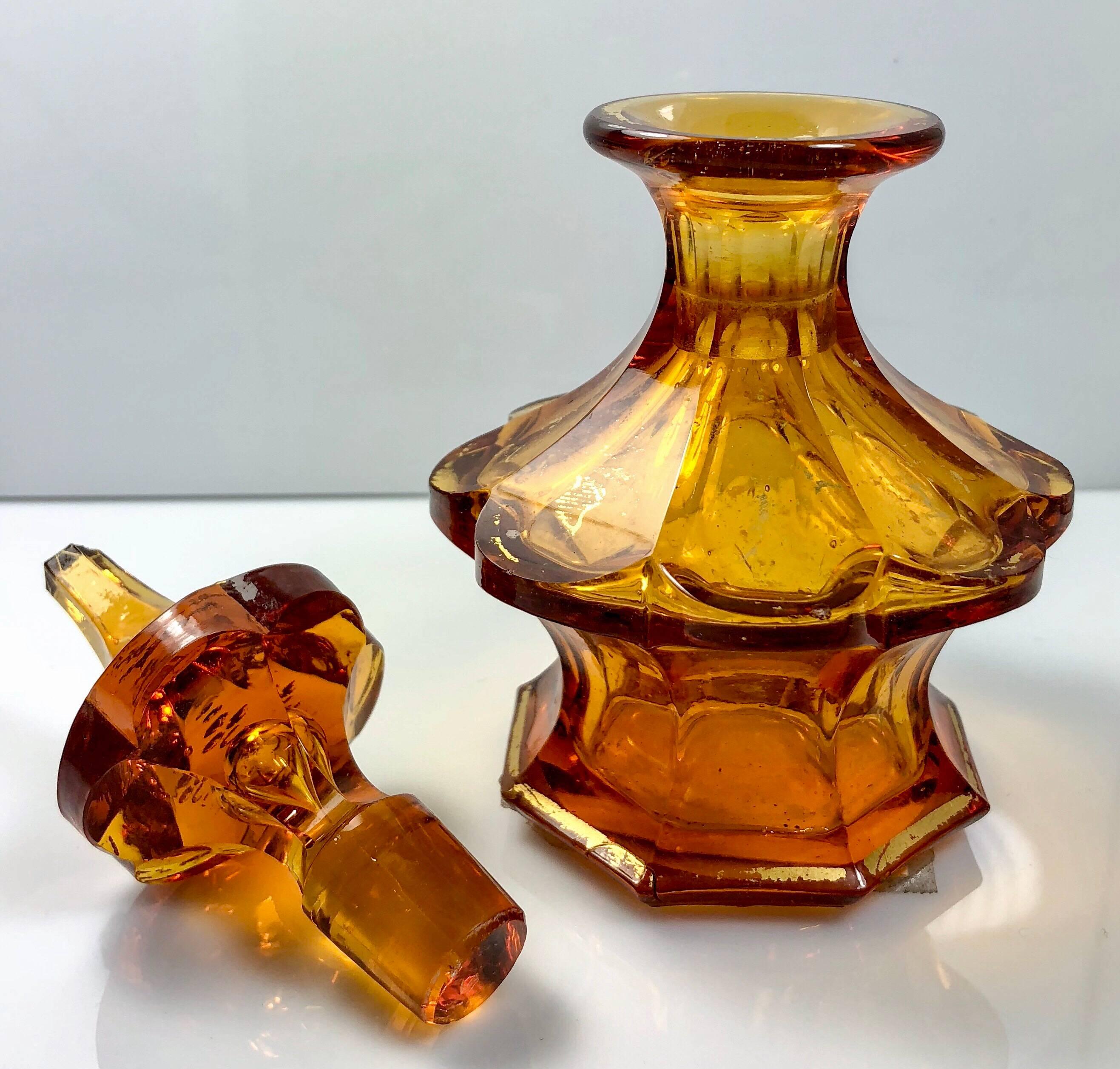 Antique Austrian cut amber glass perfume bottle with gold-leaf details, Circa 1890's.