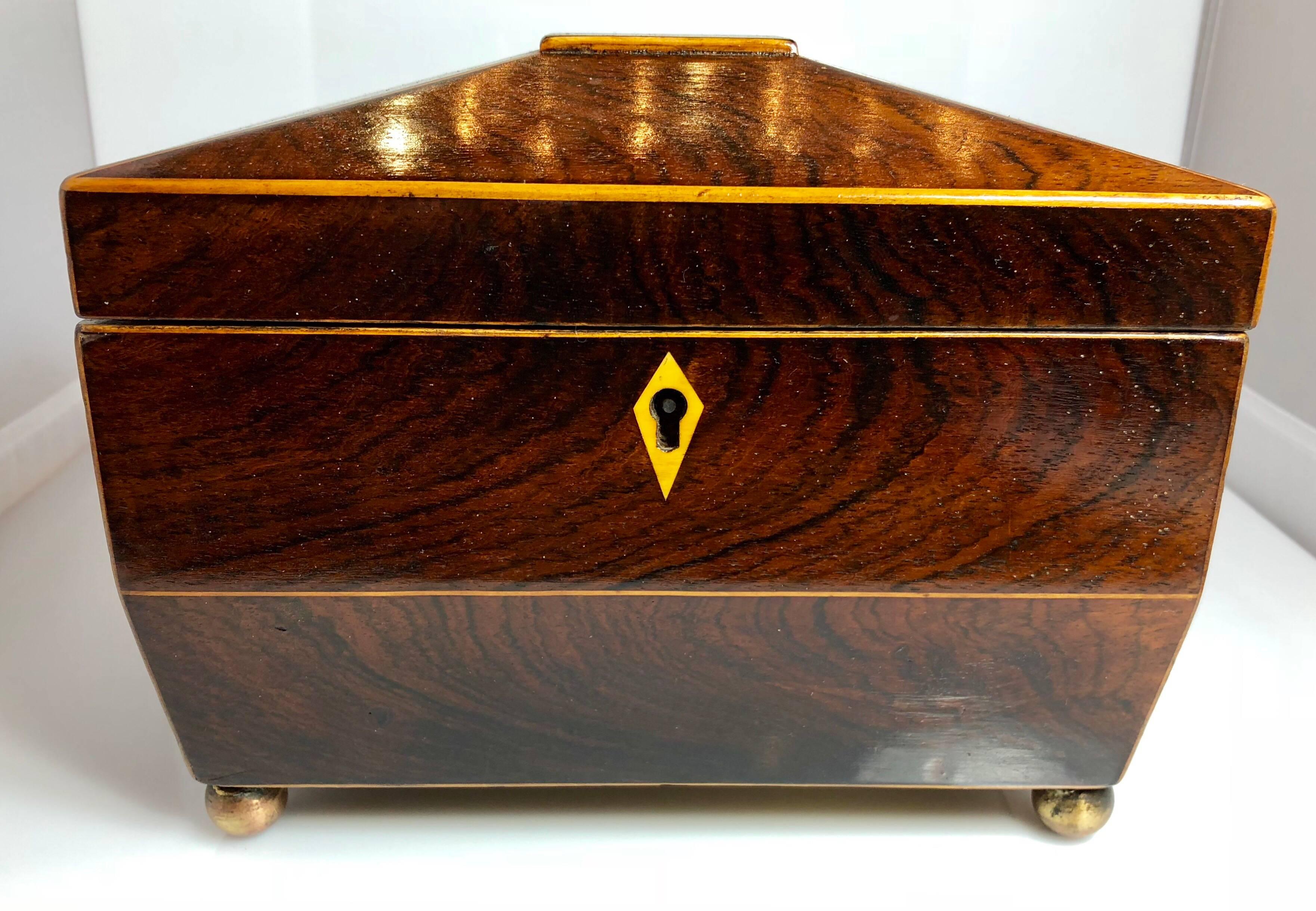 Antique English rosewood tea caddy with brass mounts, circa 1880.