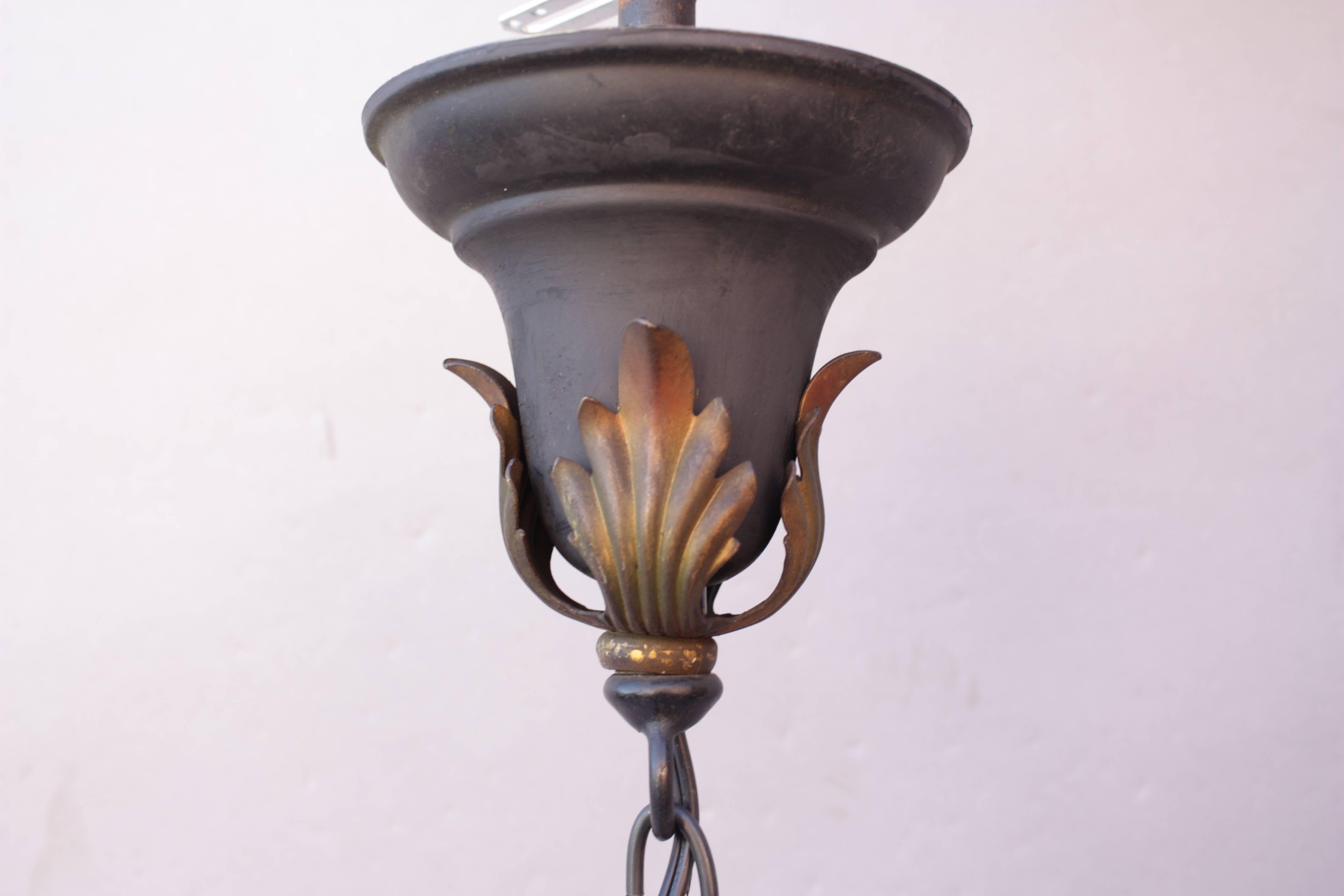 Spanish Revival chandelier with original polychrome finish, 1920s. The chain can easily reduced for low ceilings. 

Measures: 14
